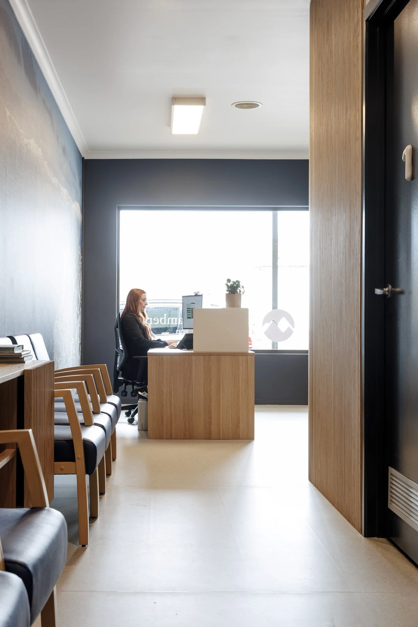 The reception area is flooded with natural light and warmth.