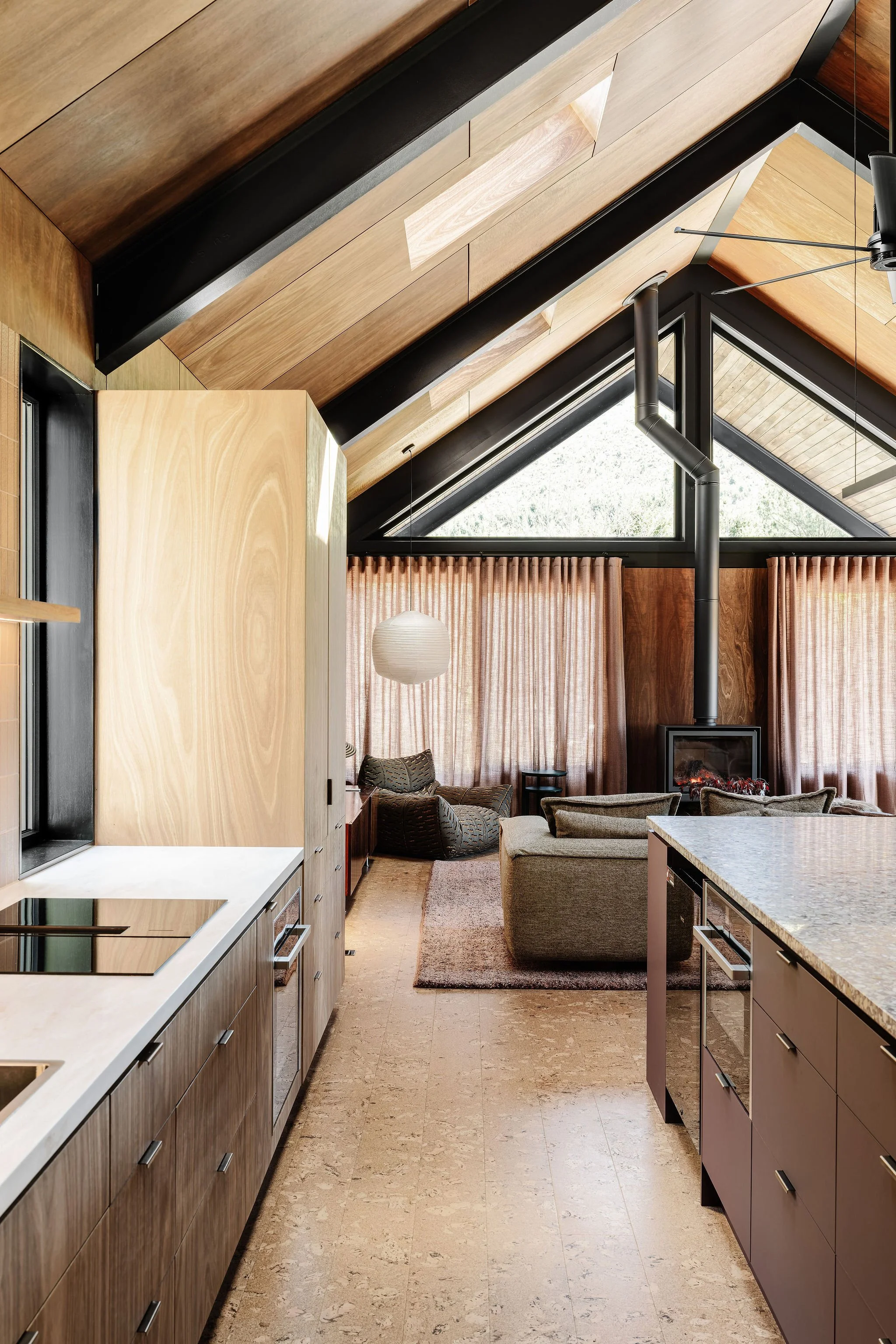 The kitchen connects effortlessly to the Living Romm beyond