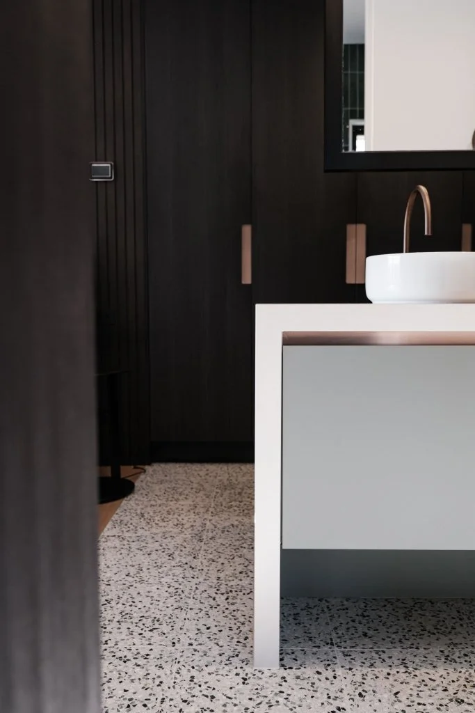 Three walls of robes provide ample storage in the suite.