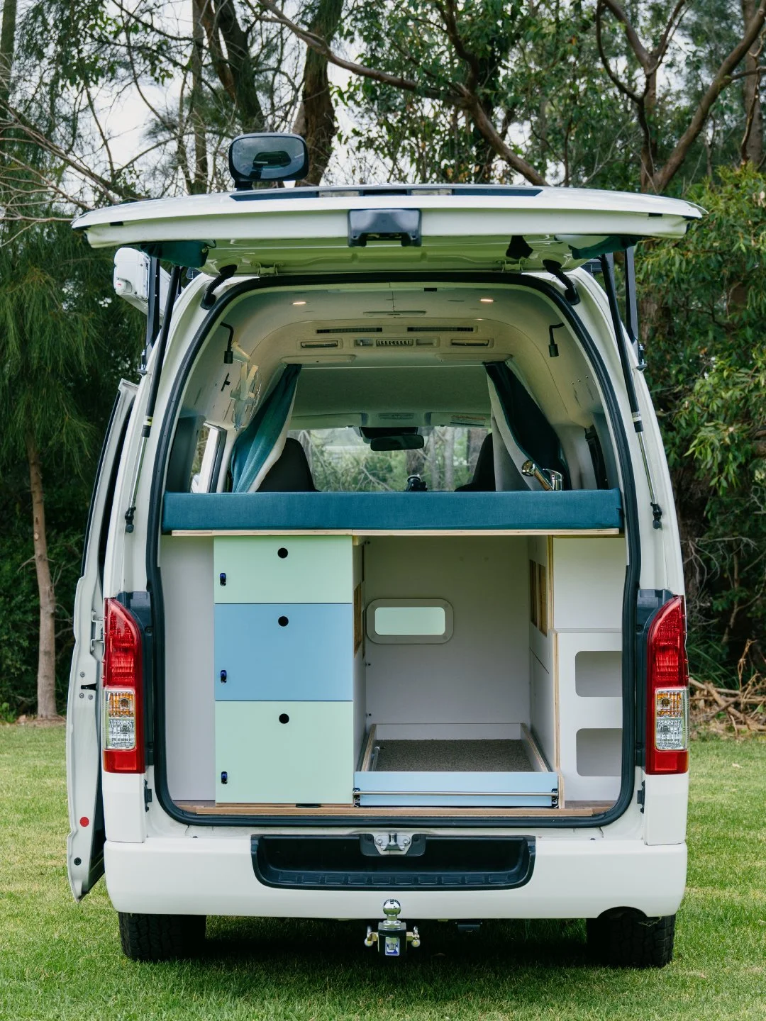 Toyota Hiace Campervan with colourful cabinetry and off-grid electrical system
