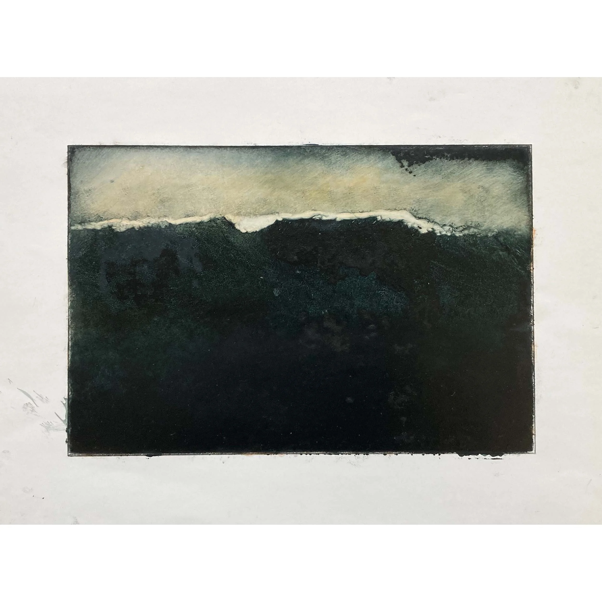 glint of light on dark breaking wave againts yellow ochre sky