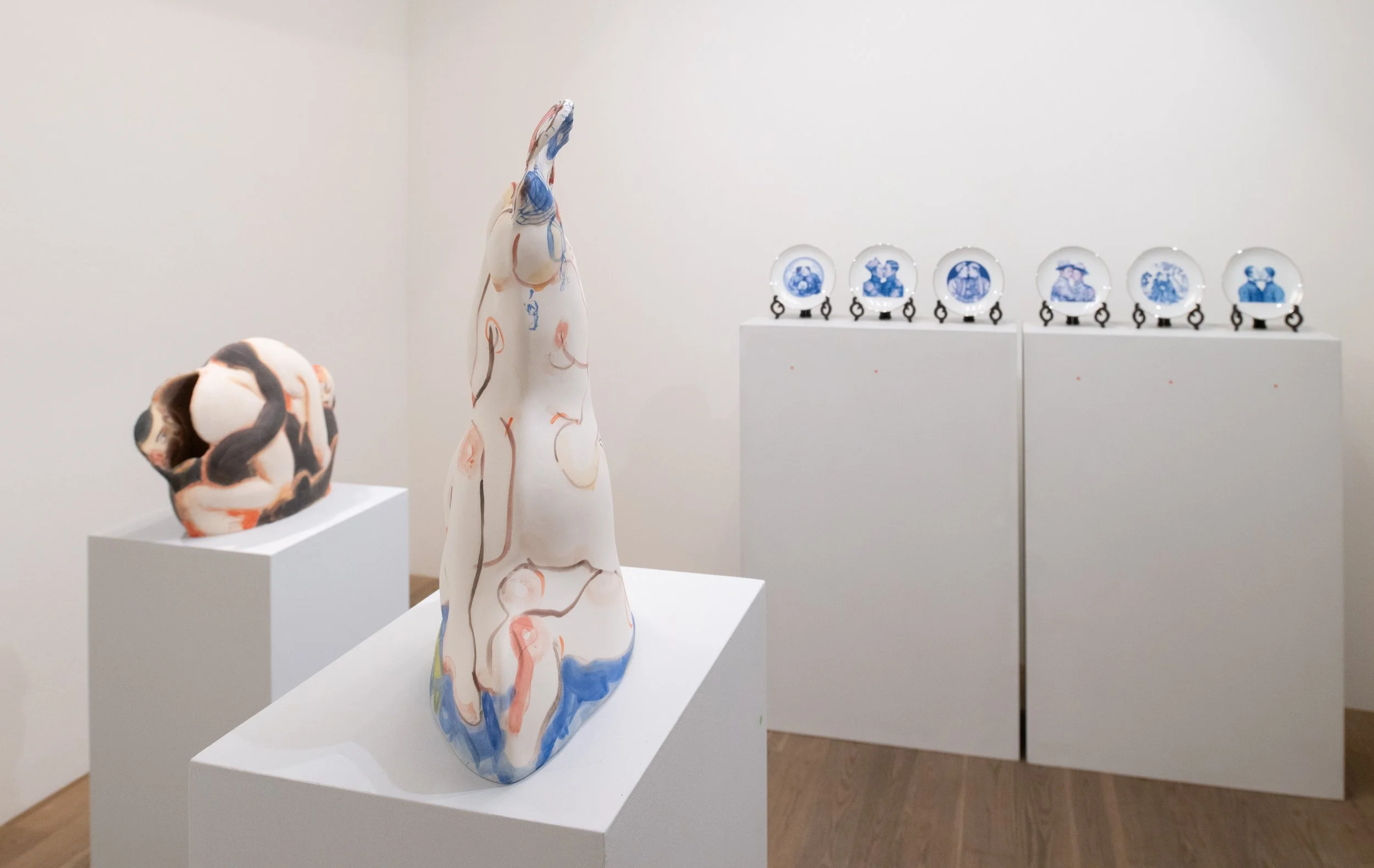 ceramic sculptures in a gallery with white walls