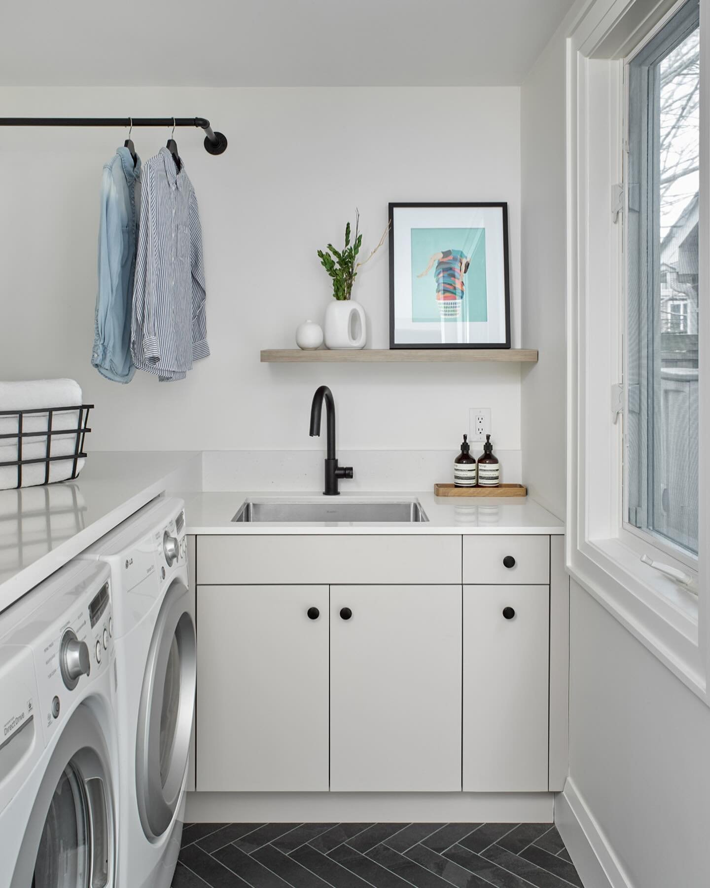 Small spaces requires more planning to make it functional yet beautiful. This little laundry room wasn&rsquo;t using its full capacity (see before photo). Using custom cabinetry to frame in the machine allowed us to add @cambriasurfaces countertops, 