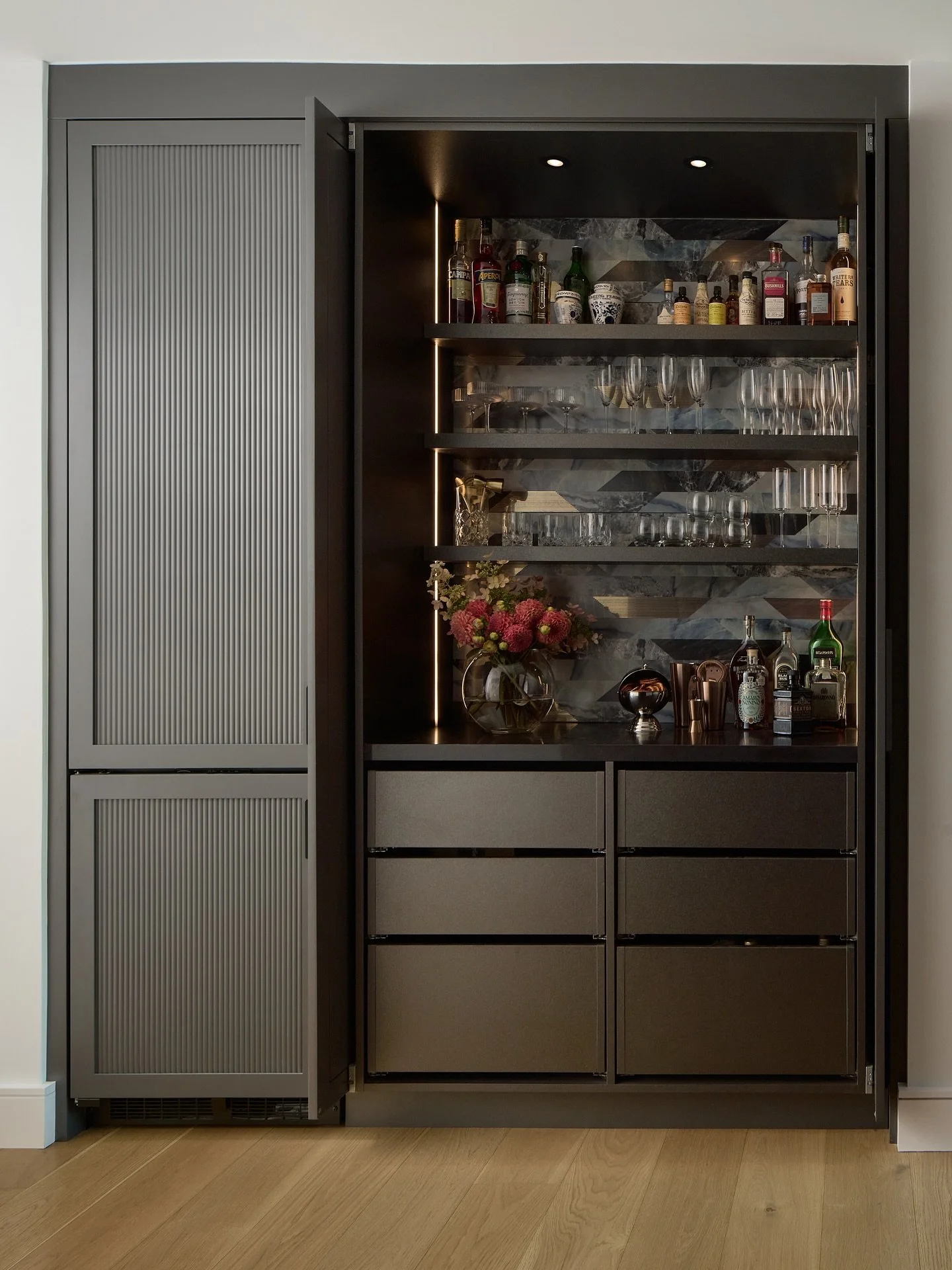 Loved creating this &ldquo;hidden&rdquo; bar for our clients. It&rsquo;s situated in the centre of the kitchen. Homeowners can choose to keep it open when entertaining and enclosed when not. 

Design: @designstrom 
Build: @steinregency | @steinbuild 