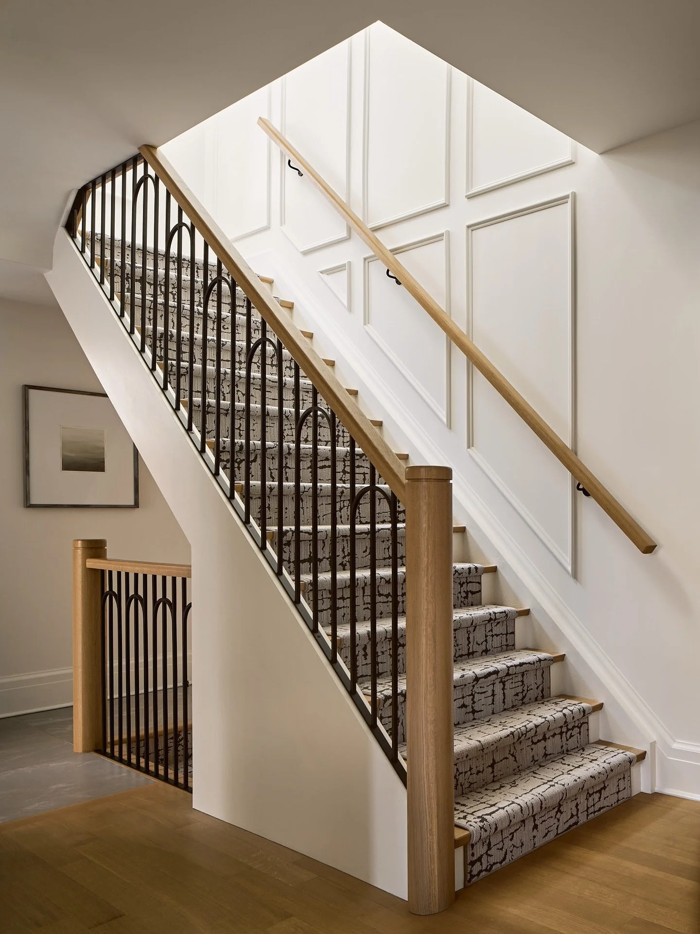 Stair glow up&hellip; updating this stair made such a big impact on the overall house. We removed the traditional wainscoting and crown, added new applied wall paneling on stair wall to emphasize the height. Designed a custom metal railing with soft 