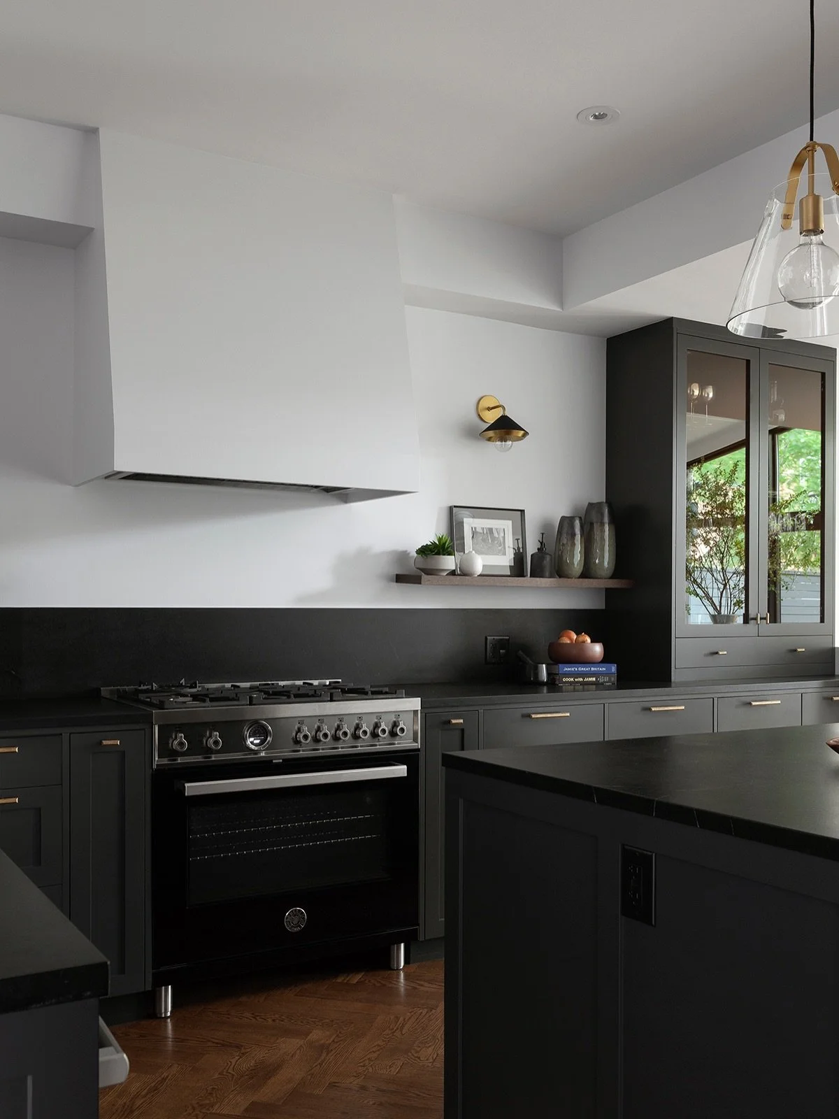 A moody, grounded dark kitchen sits at the heart of our client&rsquo;s light-filled main floor&mdash;creating a striking yet balanced contrast.

Designed in collaboration with @mosssund , this project remains one of our favorites. Since then, the hom