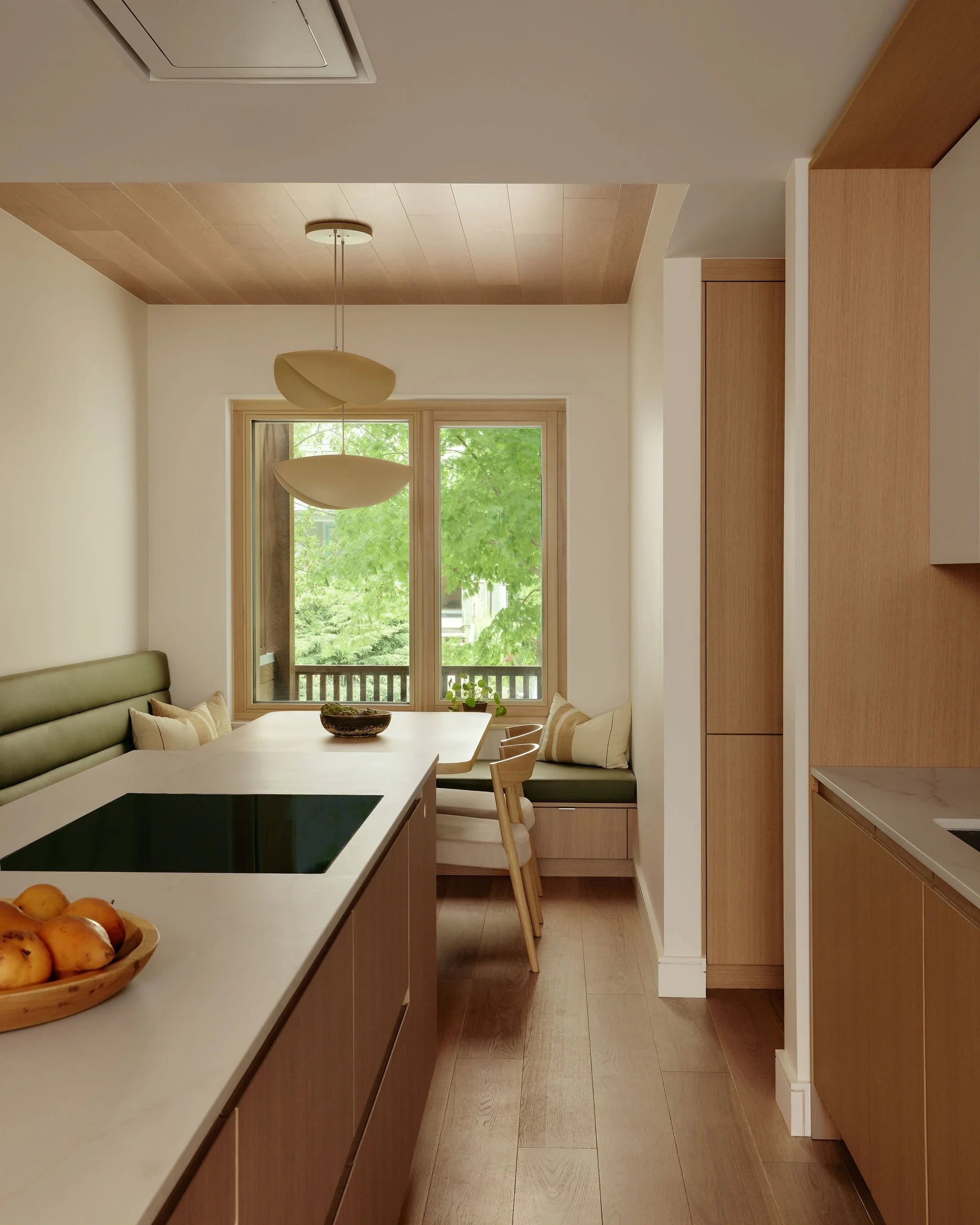 08 prefab-passive-house kitchen flow to dining.jpeg
