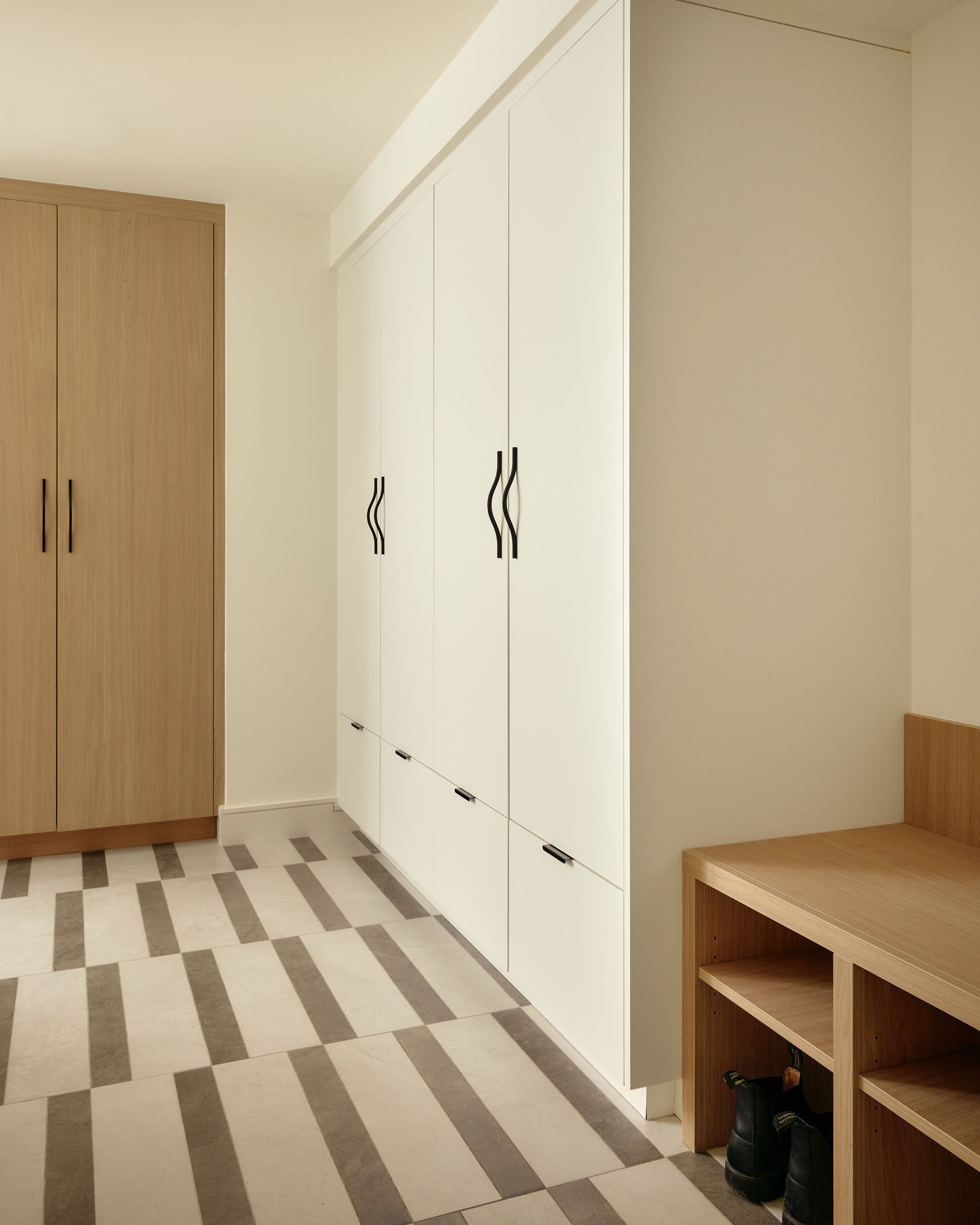 18 prefab-passive-house Mud Rm Millwork Custom Porcelain tile.jpeg