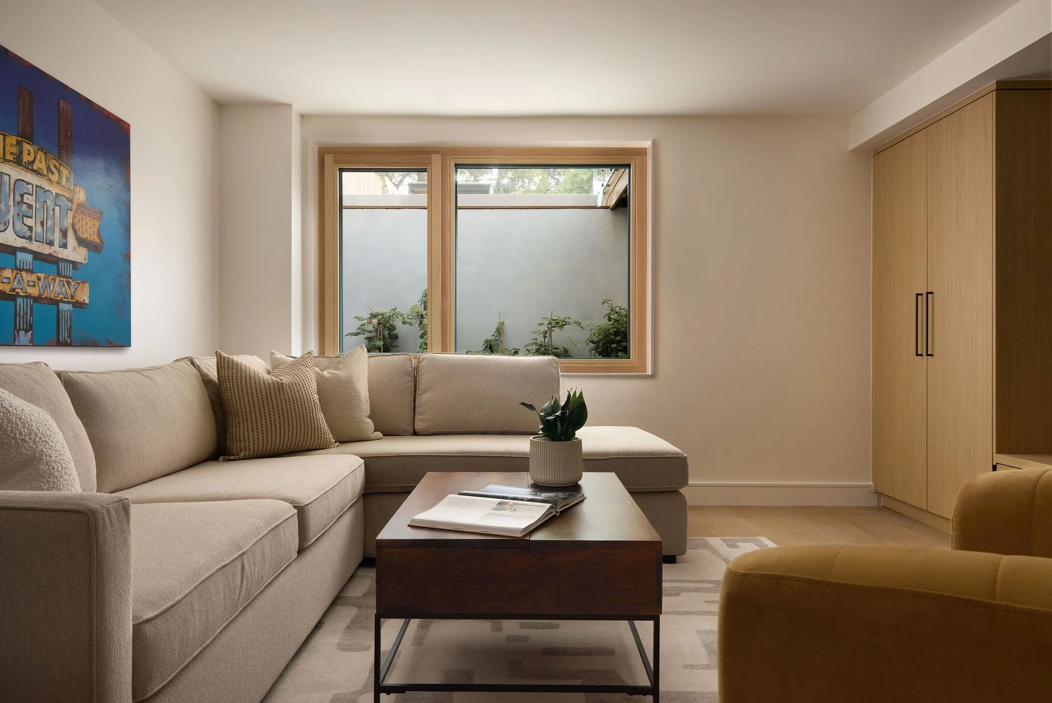 19 prefab-passive-house Basement Family Rm Window Well.jpeg