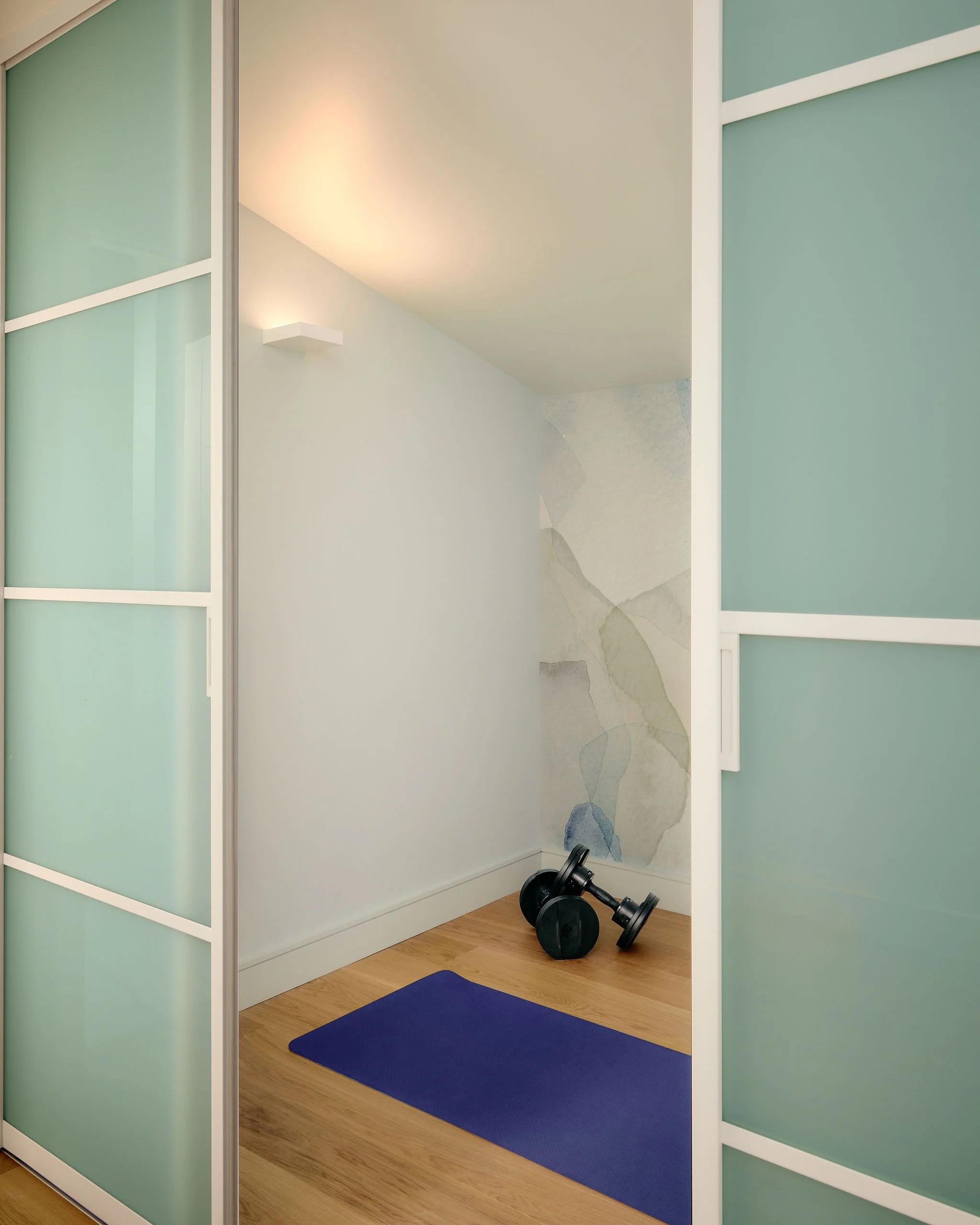 14 prefab-passive-house sliding glass door yoga room.jpeg