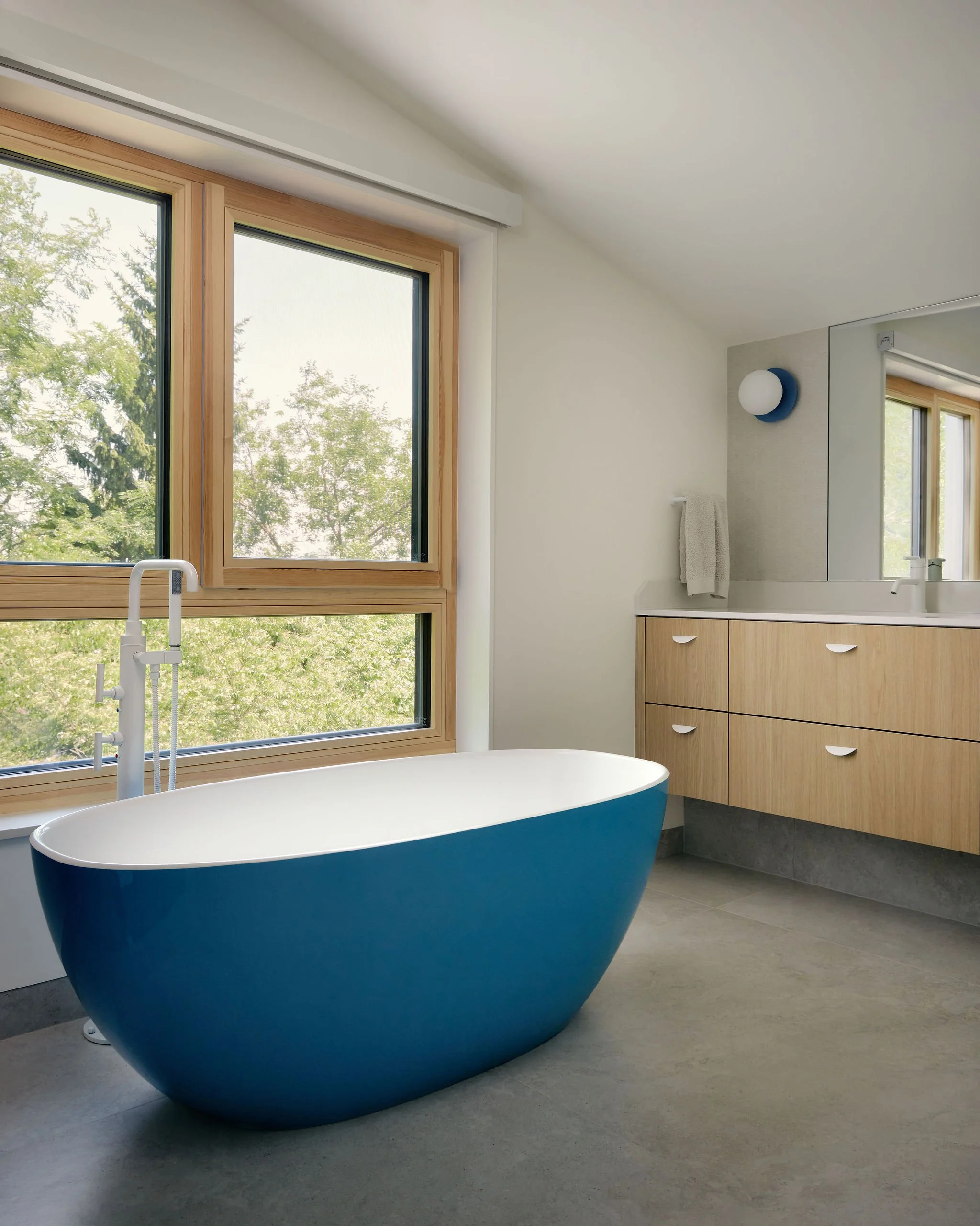 16 prefab-passive-house Blue Freestanding Tub Floating vanitiy.jpeg