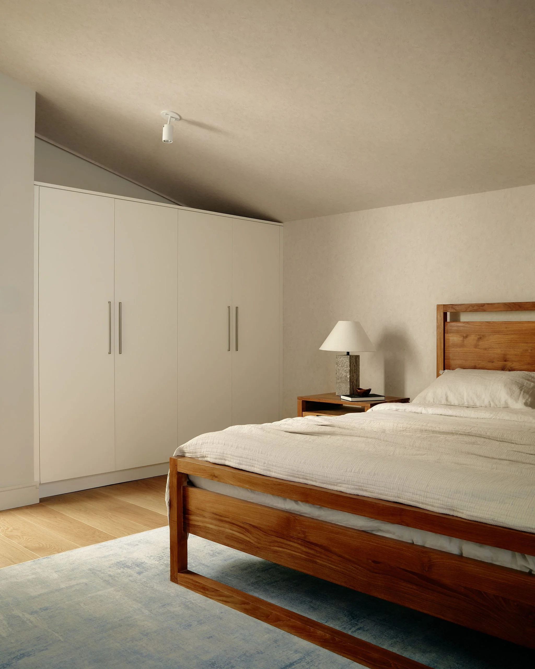 11 prefab-passive-house Principal Bedroom Sloped roofline.jpeg
