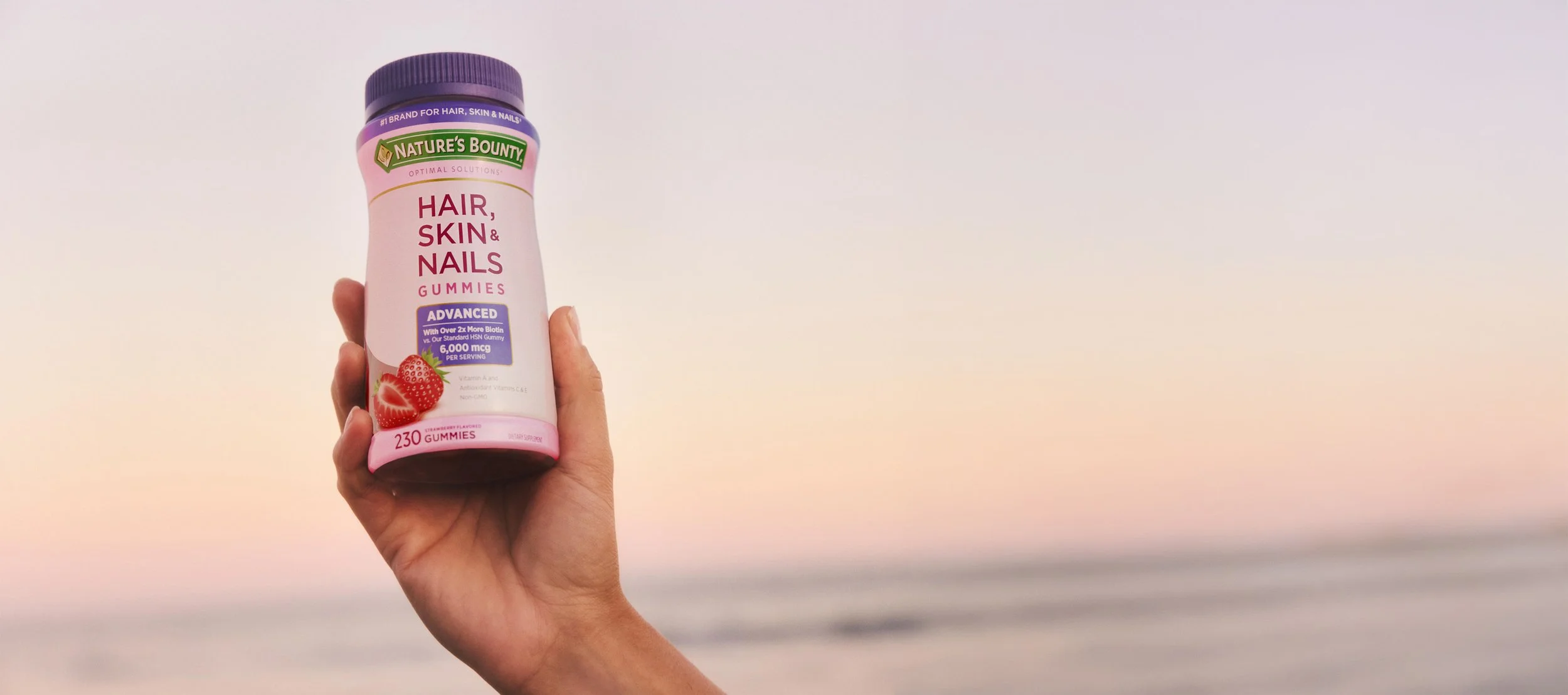 Arm holding Hair, Skin & Nails.jpg