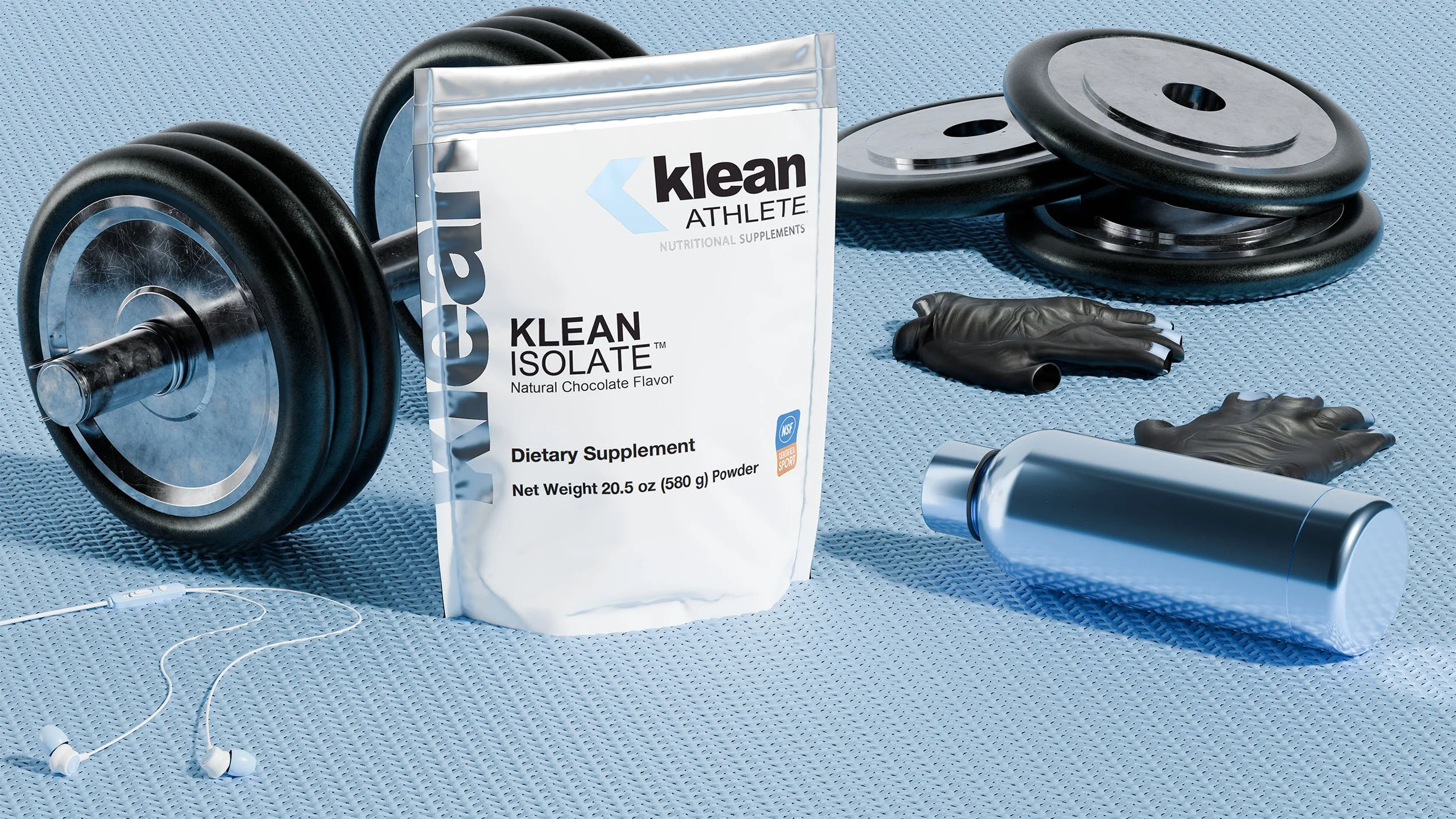 A bag of Klean Isolate protein powder, a silver water bottle, black weight plates, black gym gloves, and white earbuds on a blue textured gym mat.
