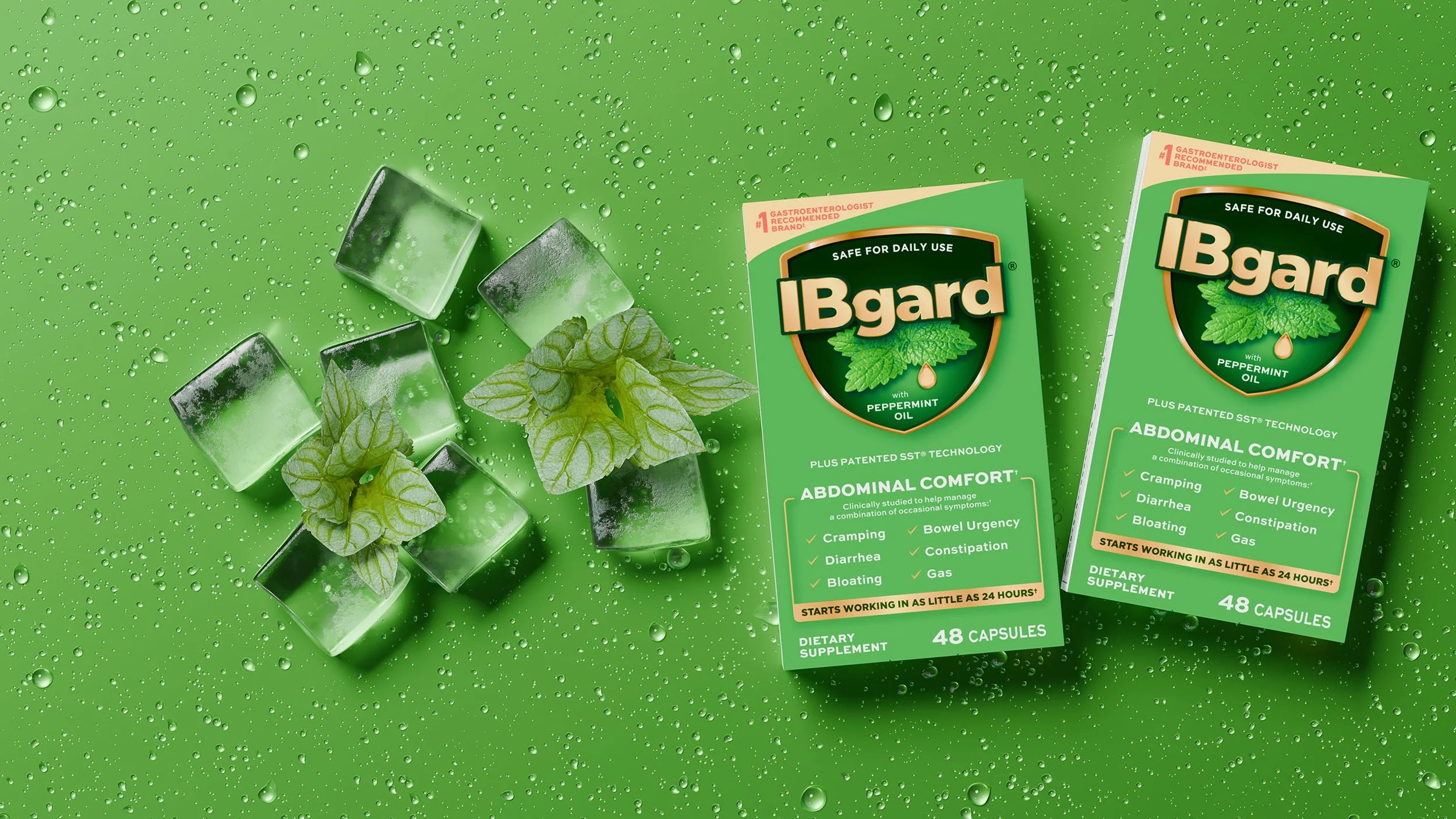 Two boxes of IBgard dietary supplement capsules, with a sprig of mint, ice cubes, and water droplets on a bright green background.