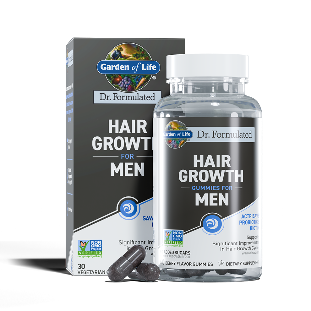 Bottle and box of Garden of Life Dr. Formulated Hair Growth Gummies for Men, with three berry flavor gummies in front.