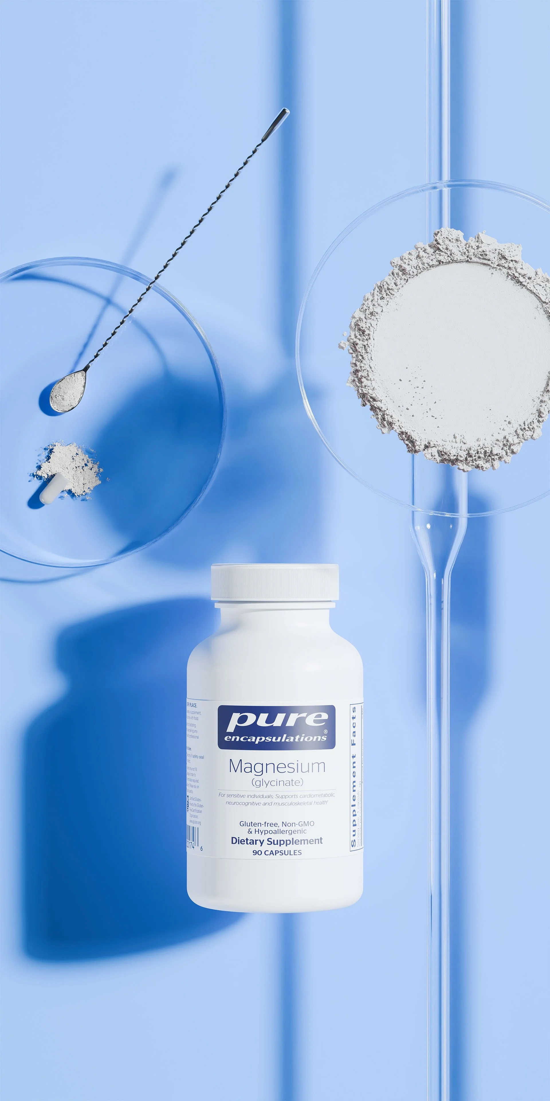 A white bottle labeled 'Pure Encapsulations Magnesium (glycinate) Dietary Supplement' on a light blue background, with glass petri dishes containing powdered magnesium and a metal rod.
