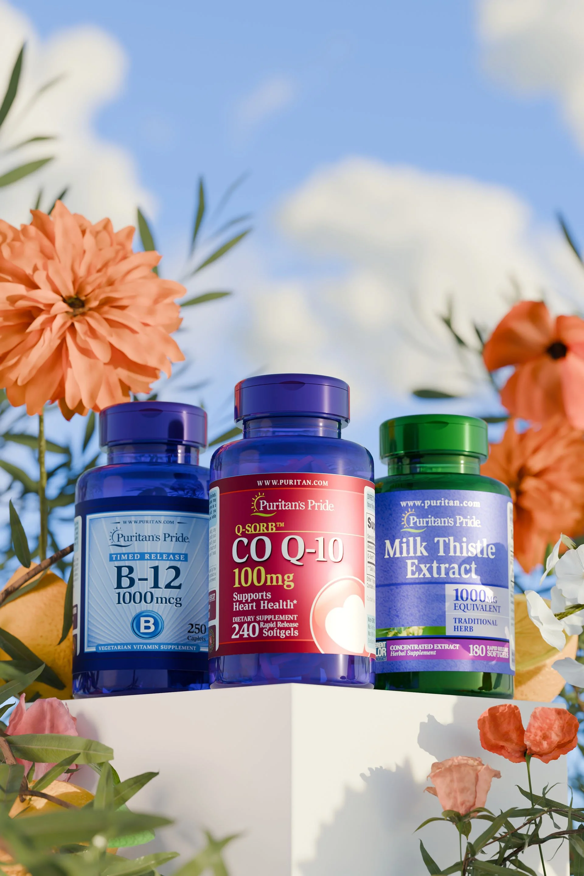 Three bottles of dietary supplements on a white surface outdoors with flowers and sky in the background. The bottles are labeled B-12, CoQ10, and Milk Thistle Extract.