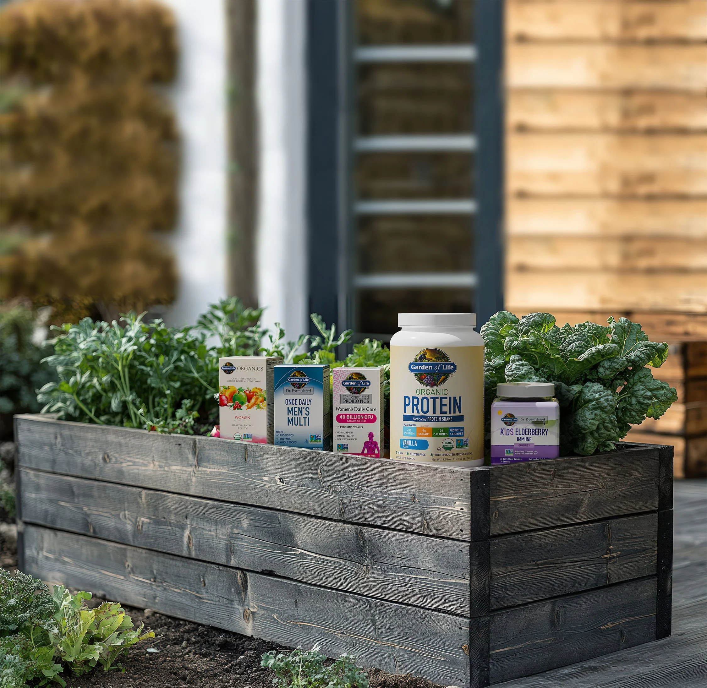 A wooden garden bed with various herbal and leafy greens, containing jars and boxes of health supplements and protein powder, outdoors near a wooden structure.