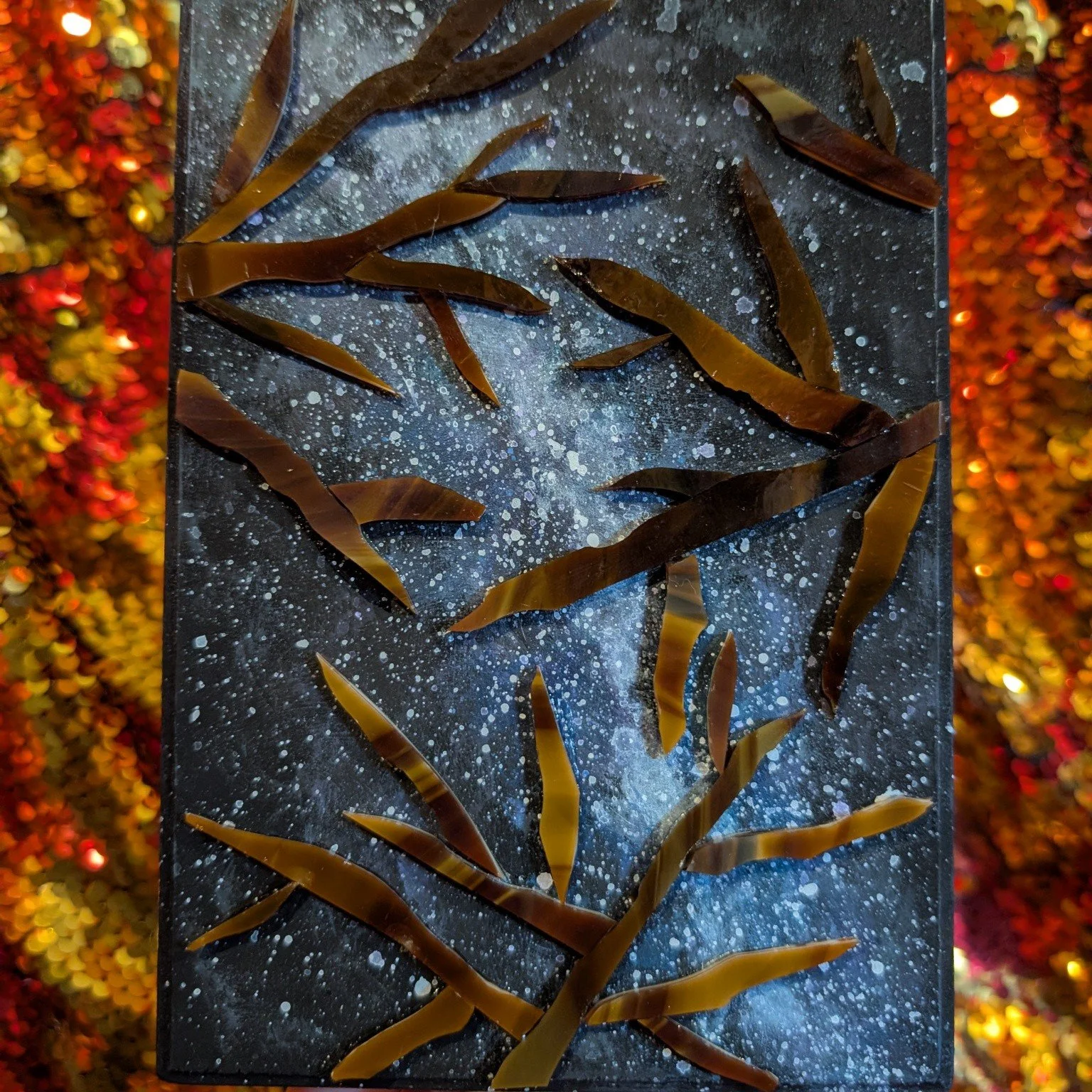 Reminiscent of camping, late night star gazing, and hikes, I painted an interpretation of the Milky Way galaxy and utilized mosaic pieces of glass to represent tree branches. This 4x6 inch panel of wood needs a better hanging/framing system in place 