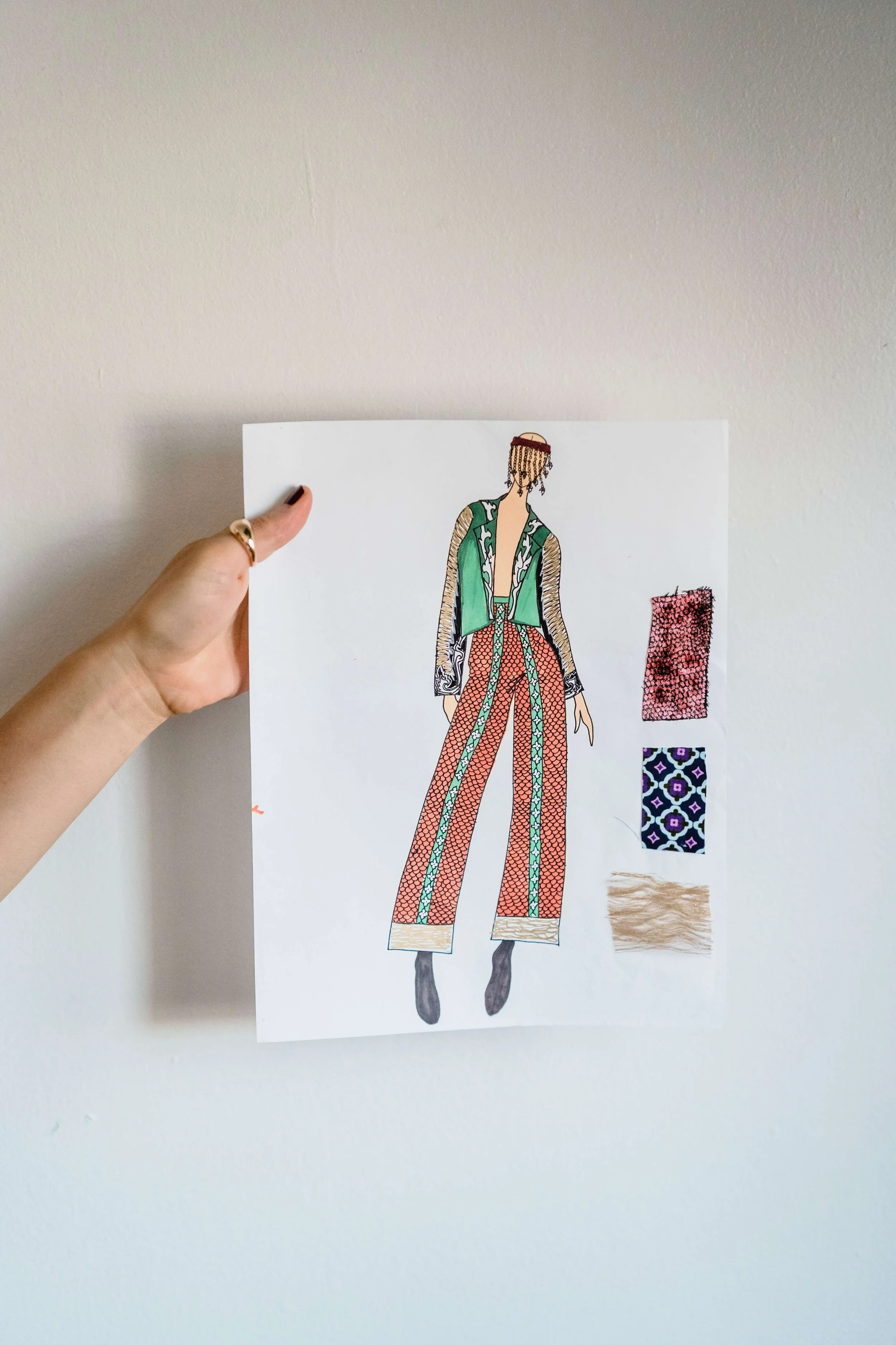 drawing and sketching of a design on paper before sewing