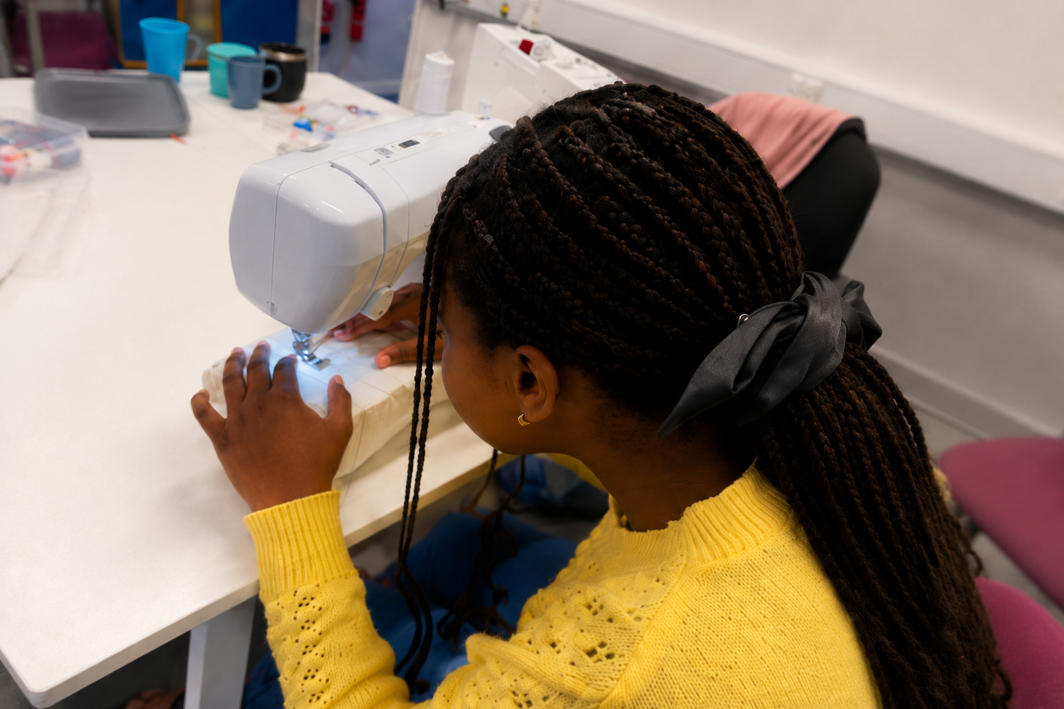 Sewing in a bright craft room.png