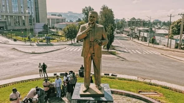 Bronze memorial statue of Tilahun Gessesse holding a microphone at Sidist Kilo in Addis Ababa