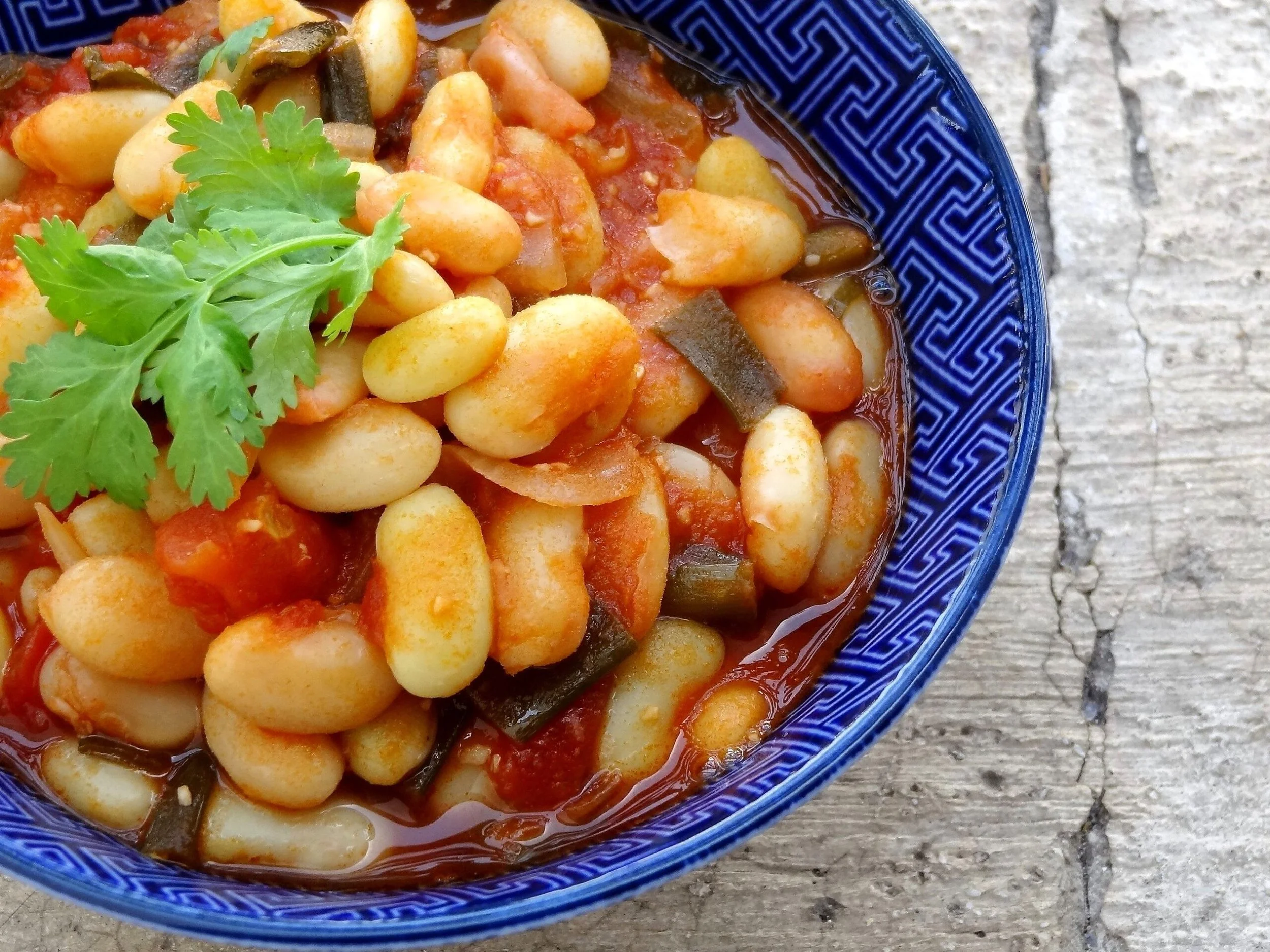 Congolese white bean madesu cooked in a rich tomato sauce