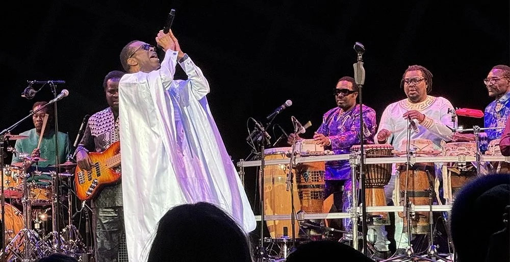 Youssou N'Dour performing Mbalax music rooted in Wolof language and Senegalese musical traditions.
