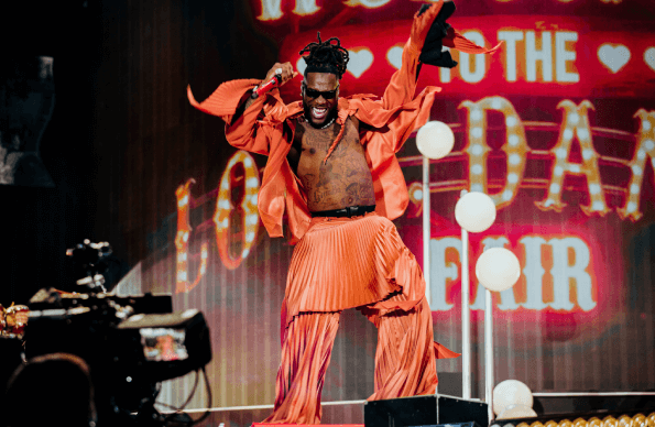 Burna Boy performing at London Stadium during an Afrobeats concert.