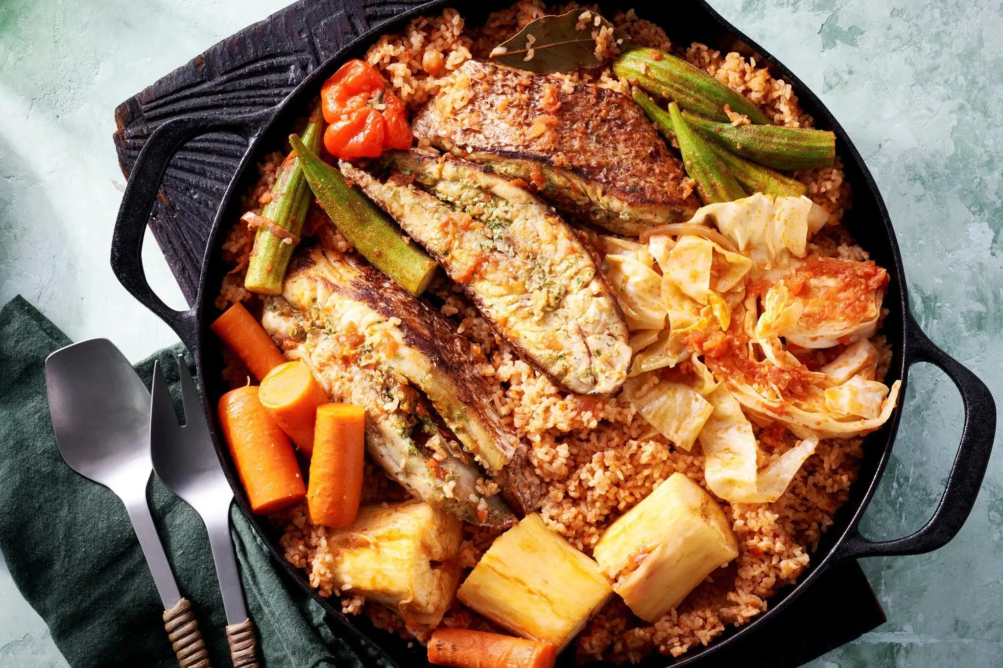 Senegalese thieboudienne with fish, rice, and vegetables.