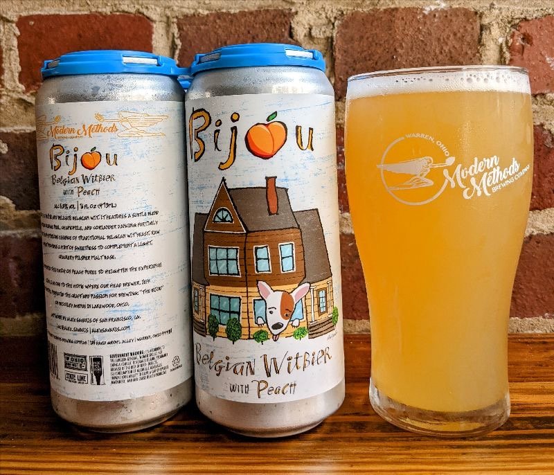 Cans of Bijou Belgian Witbier with Peach