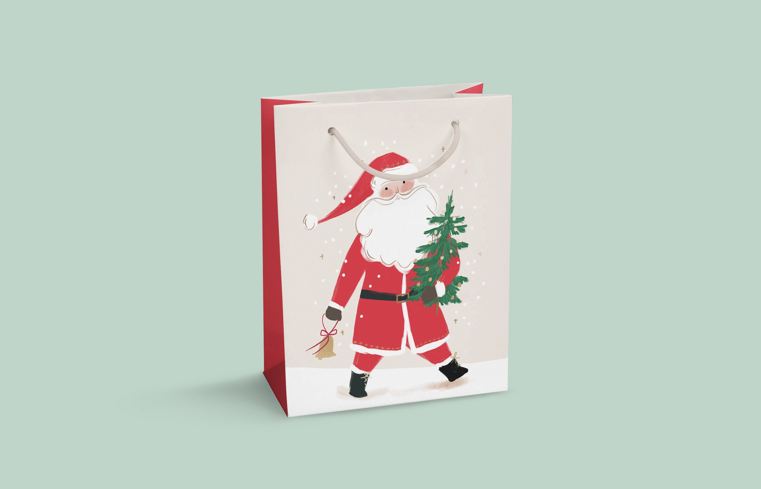 A Christmas gift bag featuring a cartoon Santa Claus holding a small tree, with festive decorations, against a light green background.