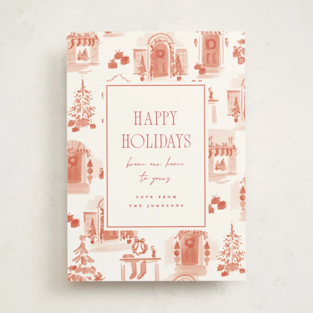 Holiday greeting card with festive house illustrations and text wishing happy holidays.