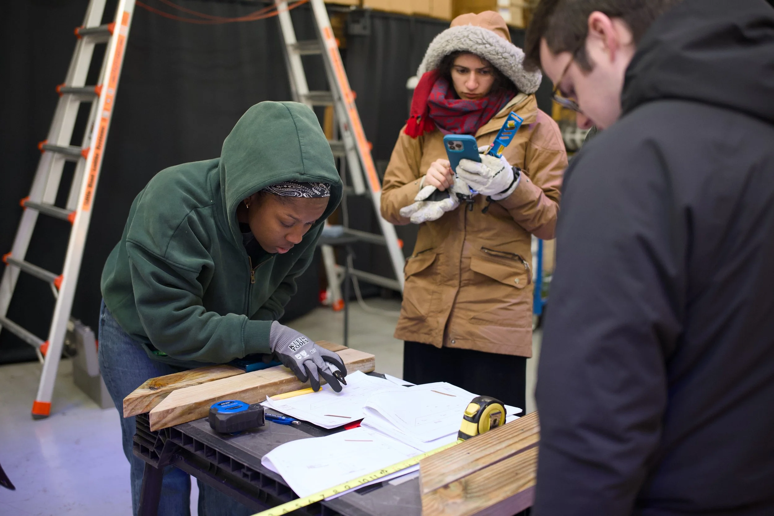 Volunteers constructing a bus stop bench
