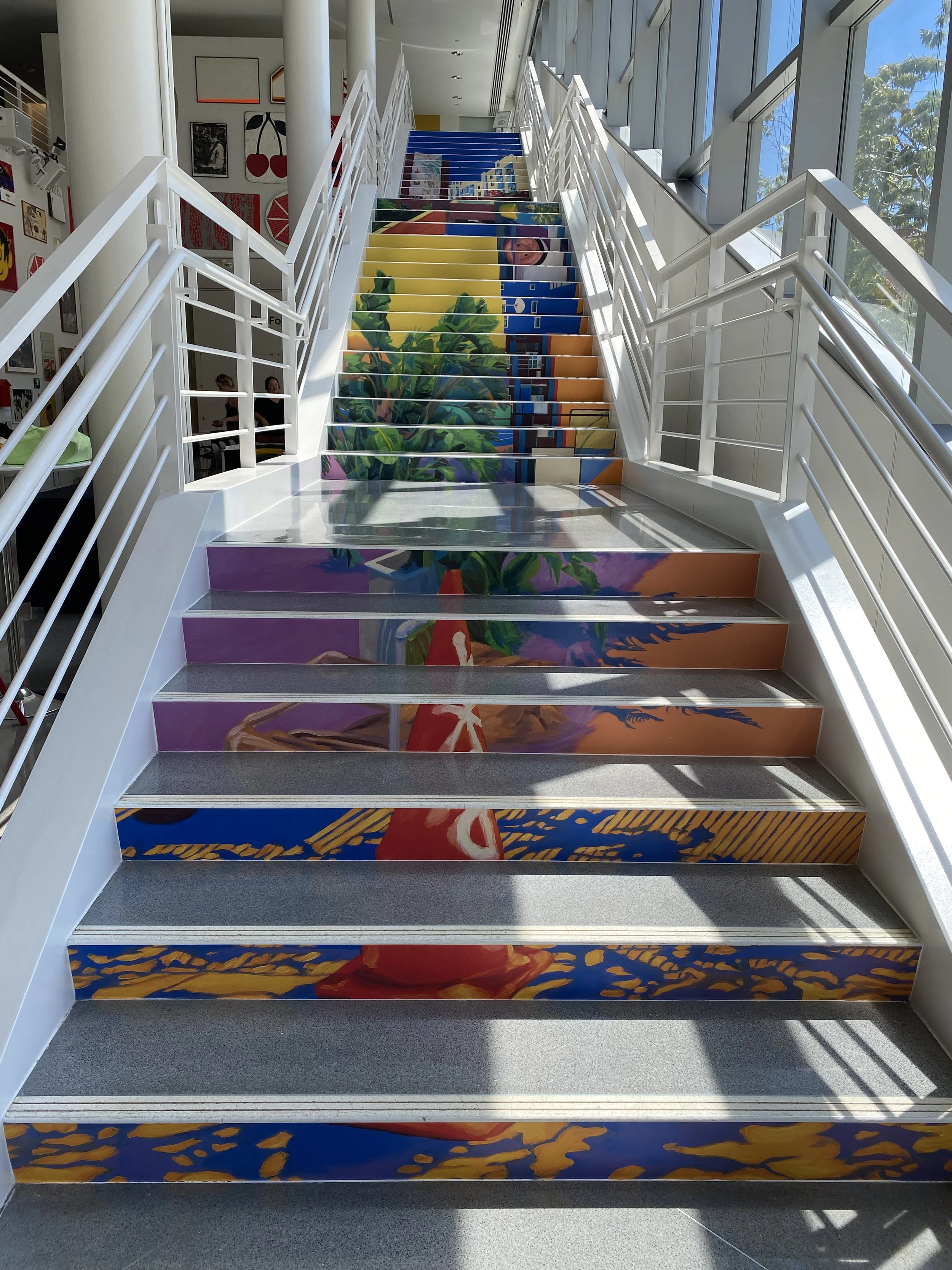  The  Makibaka  exhibit experience starts at the stairwell facing Mission Street in San Francisco, where on each step visitors are met with vibrant scenes of Bessie Carmichael School FEC, Victoria Manalo Draves Park and Alice Street Community Gardens