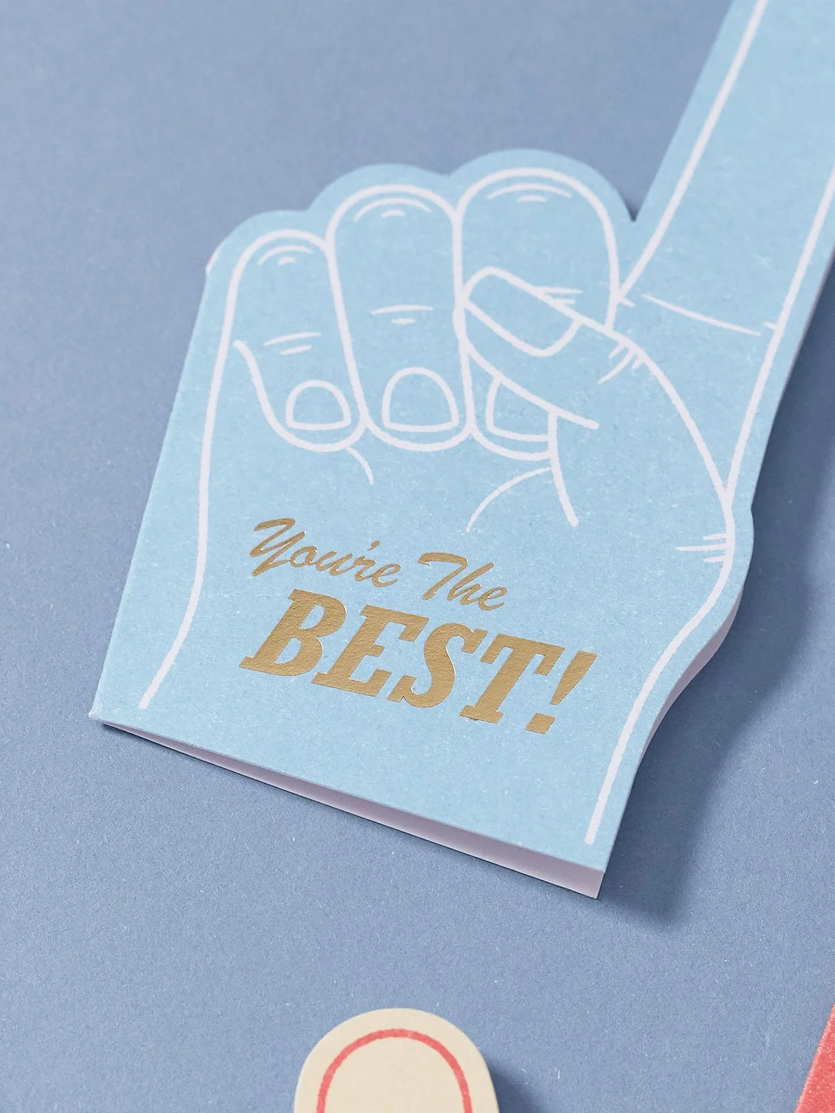 blue-foam-finger-greeting-card-with-hot-foil-you're-the-best-congratulations-close-up.jpg