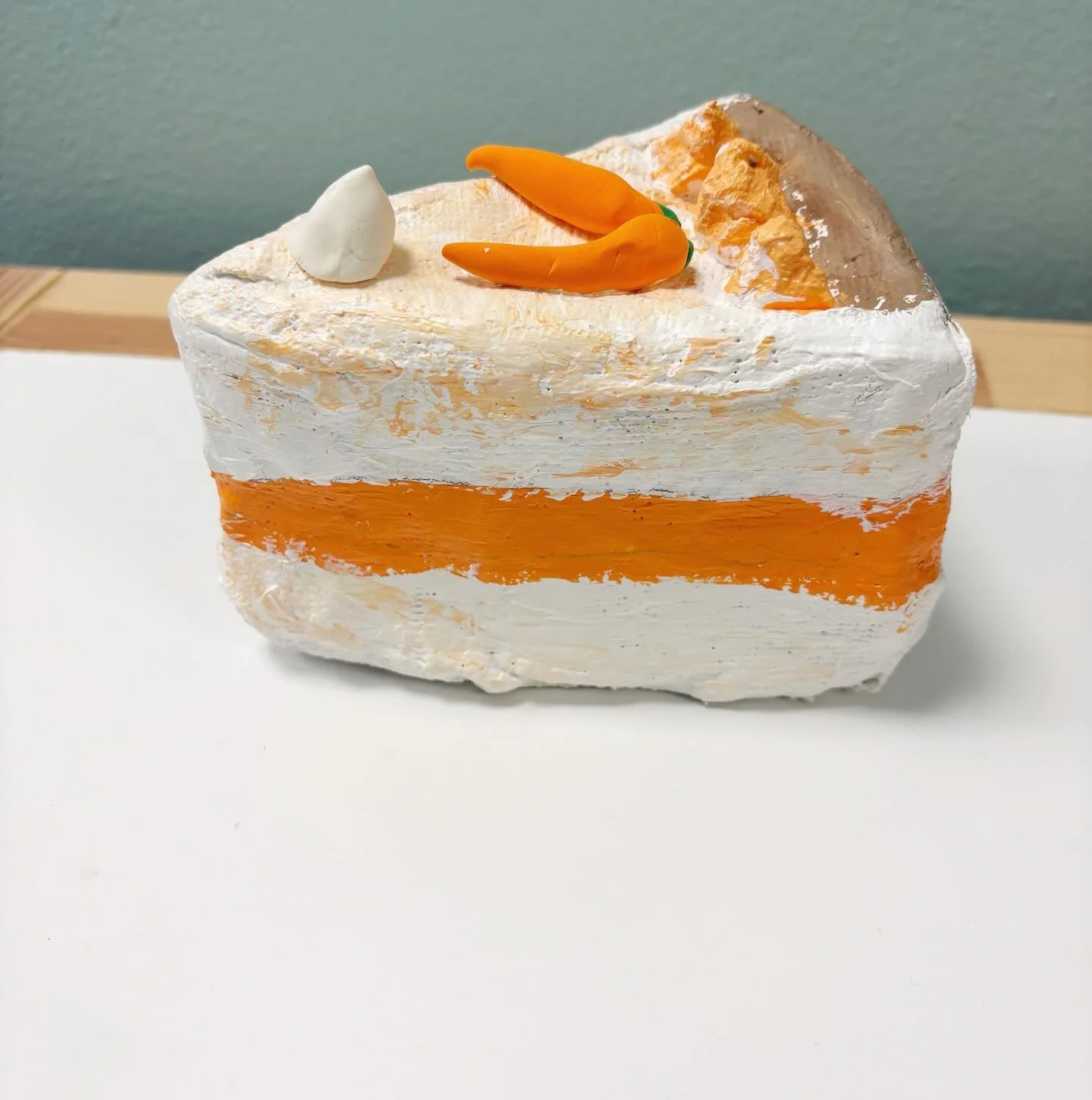 Is it cake?! 🍰

Our INCREDIBLE instructor, Miss Leah, has knocked it our of the park with our first Studio Art: Sculpture lesson of the semester! Artists were challenged to design cakes using plaster strips and cardboard. They then used paints to co