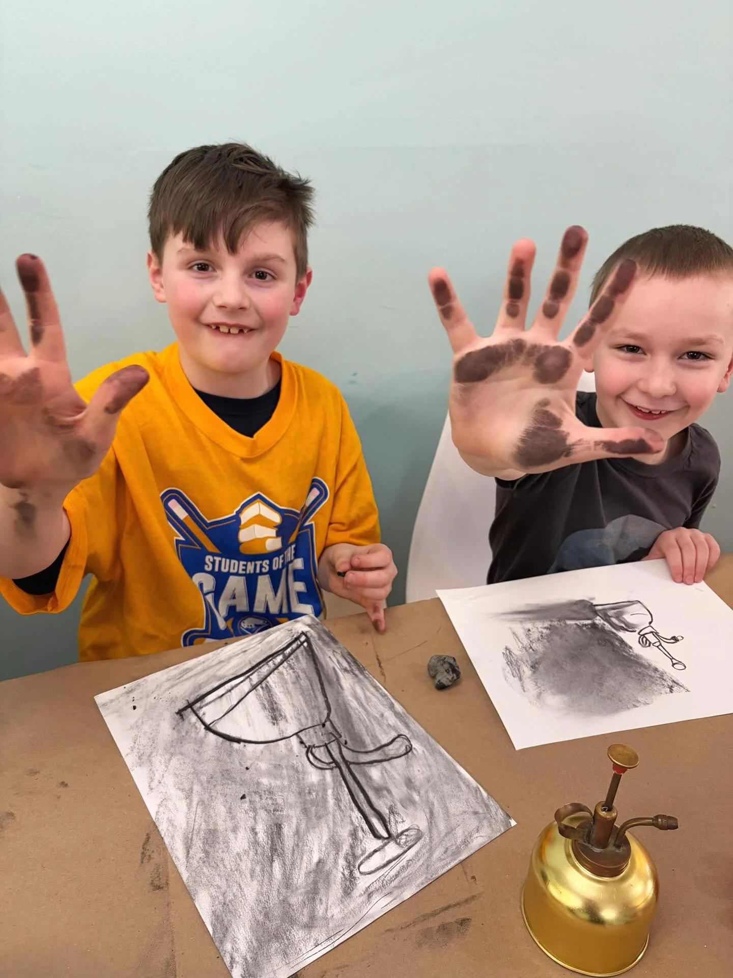 Our Studio Art: Drawing students having some fun with vine charcoal! 🖤