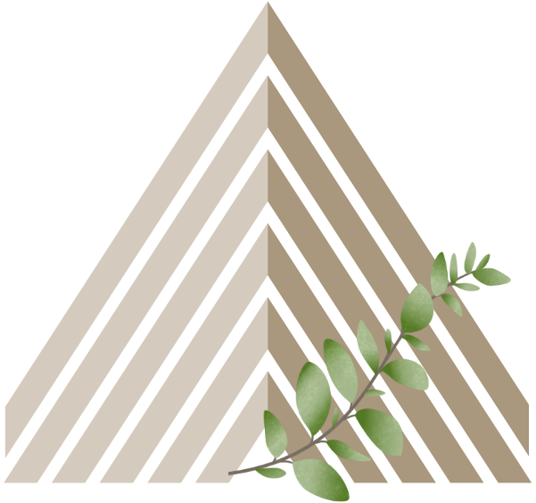 A branch with green leaves placed on a beige surface with a black background.