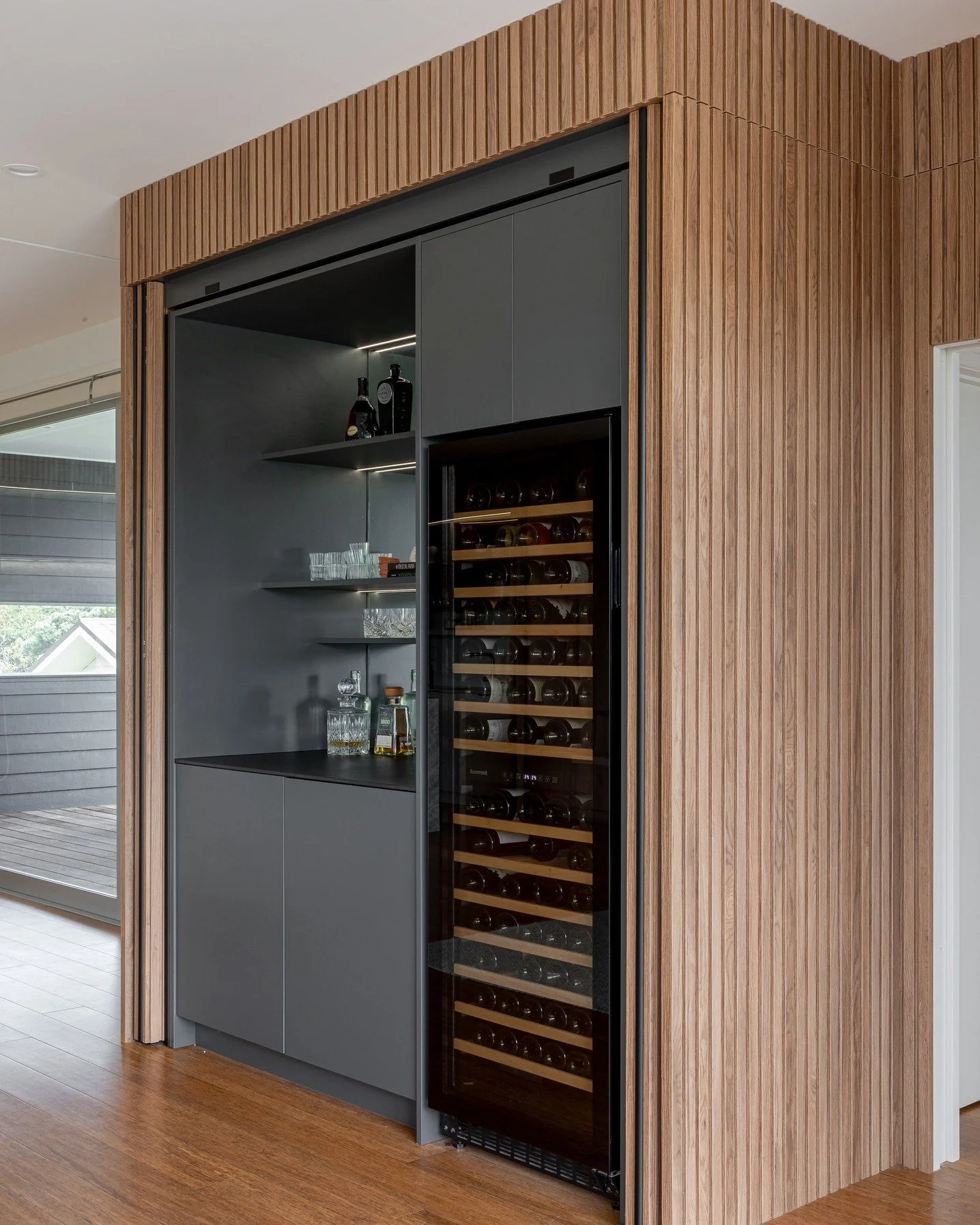 Refined simplicity meets natural warmth. This custom bar area combines natural timber tones with minimalist design, creating a space that feels both grounded and sophisticated.

Perfectly placed lighting enhances texture and depth, making it a quiet 