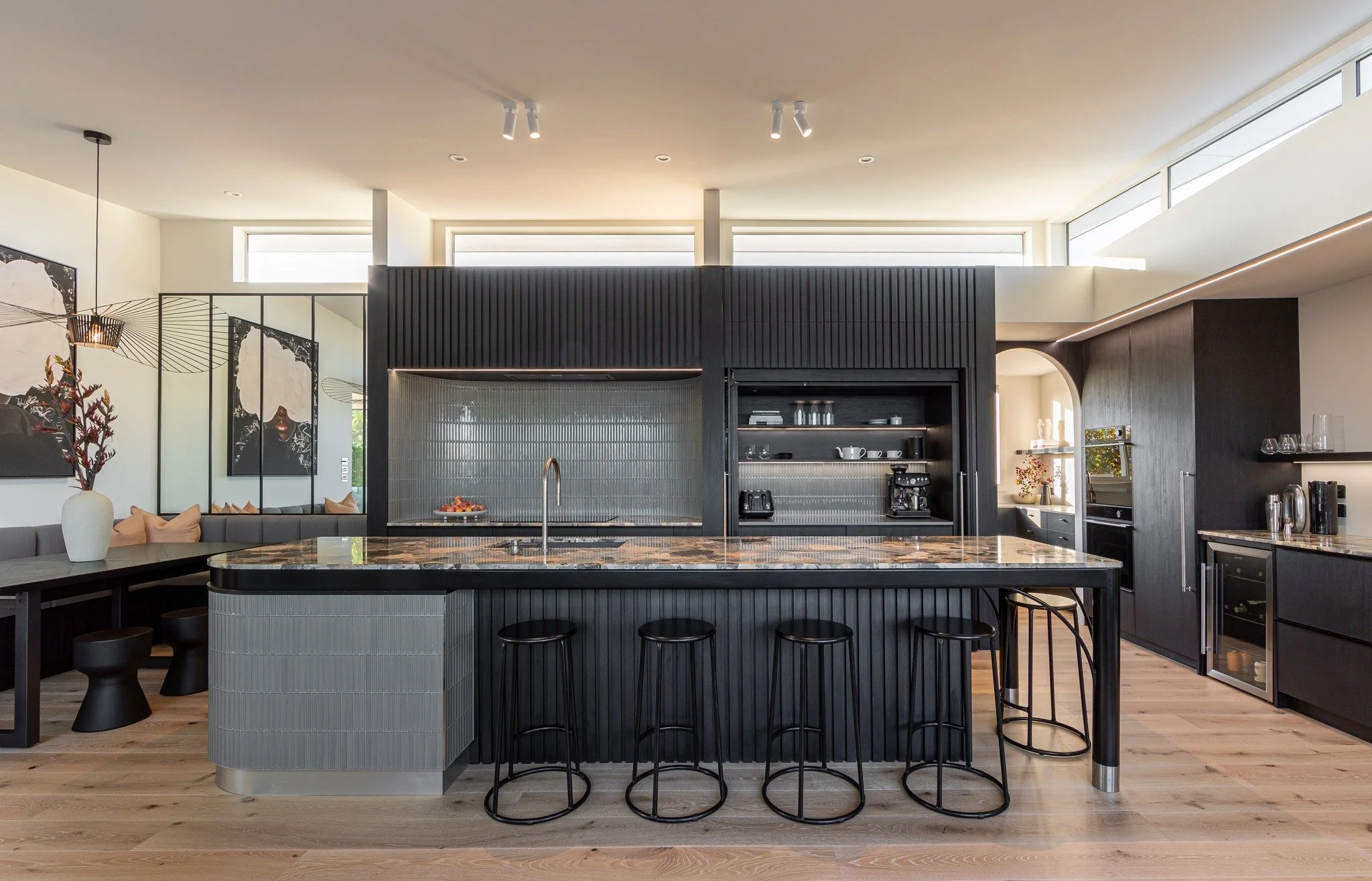 Contrast done right.
This kitchen balances depth and light through black cabinetry, soft grey tones and natural timber floors. In our latest blog, we explore how colour and material selection influence warmth, texture and timeless appeal in modern ho