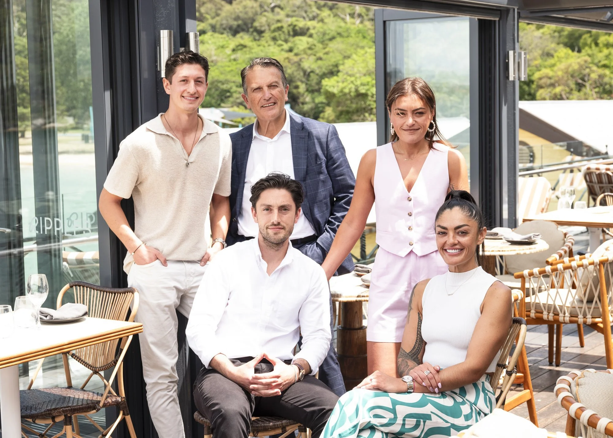 family portrait of 5 people with the harbour in the background
