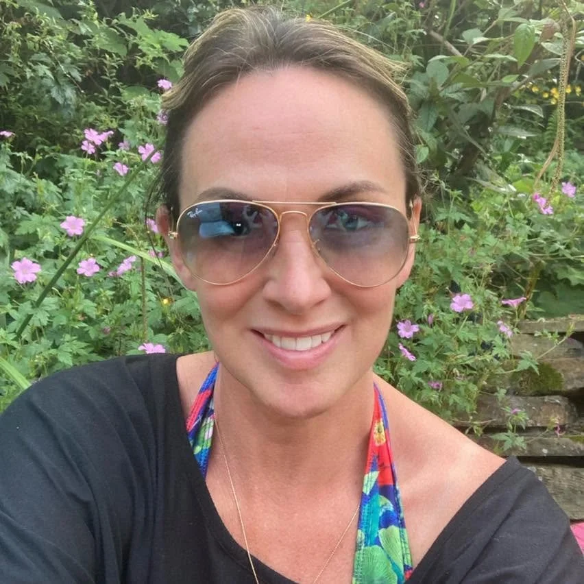 photograph of a woman wearing sunglasses