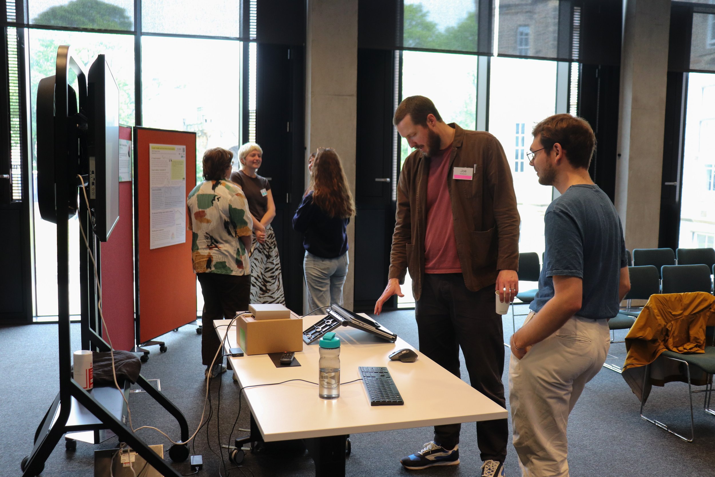 Joe Noteboom viewing Rayo Verweij's interactive poster presentation