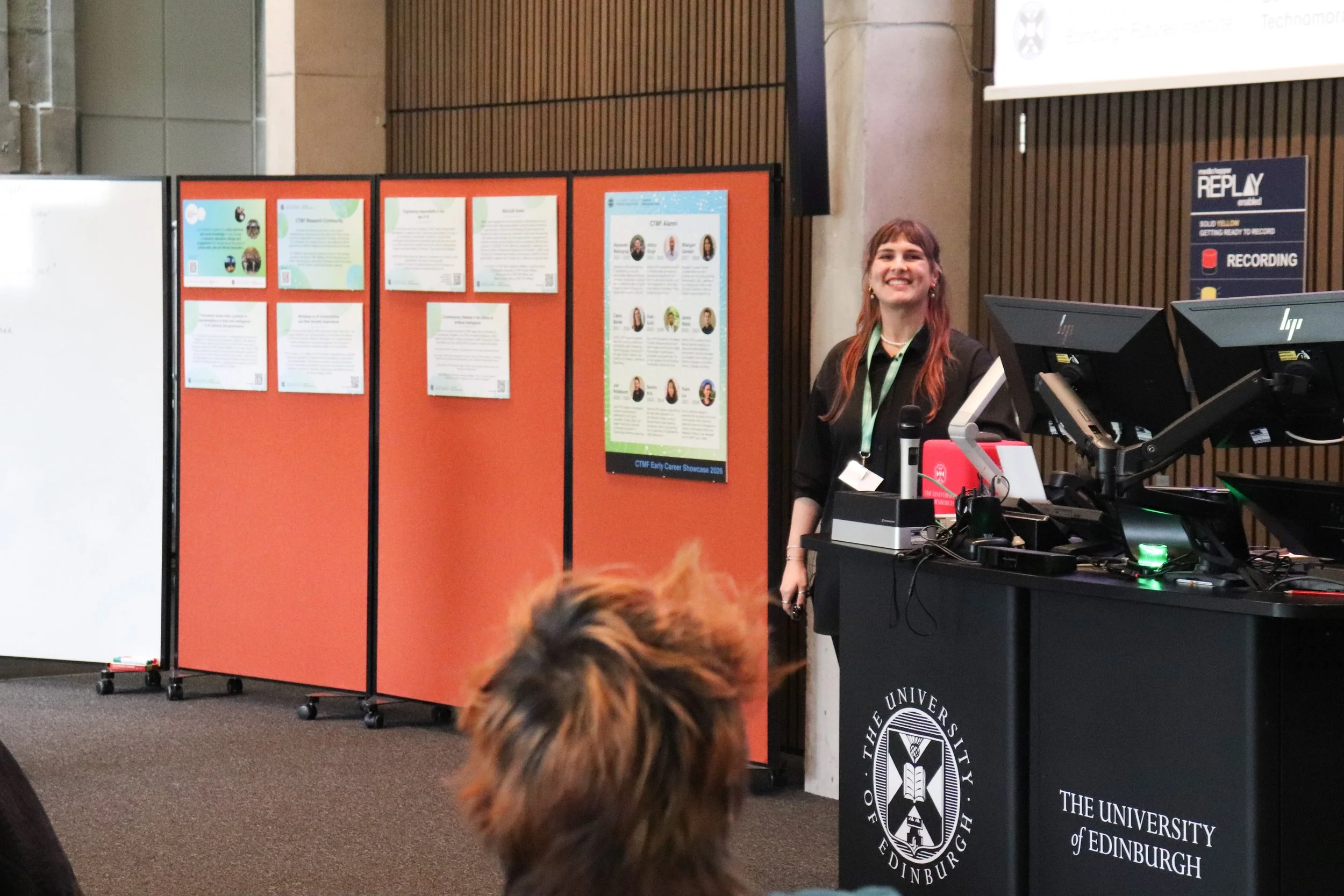Sasha Lee Smit smiling mid-presentation