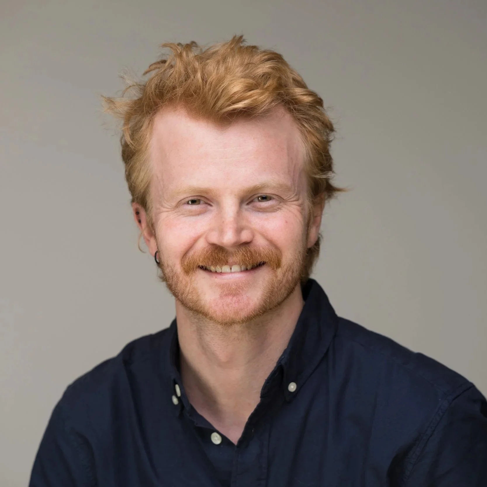 Headshot of Tobias Thejll-Madsen , who has red hair and a beard