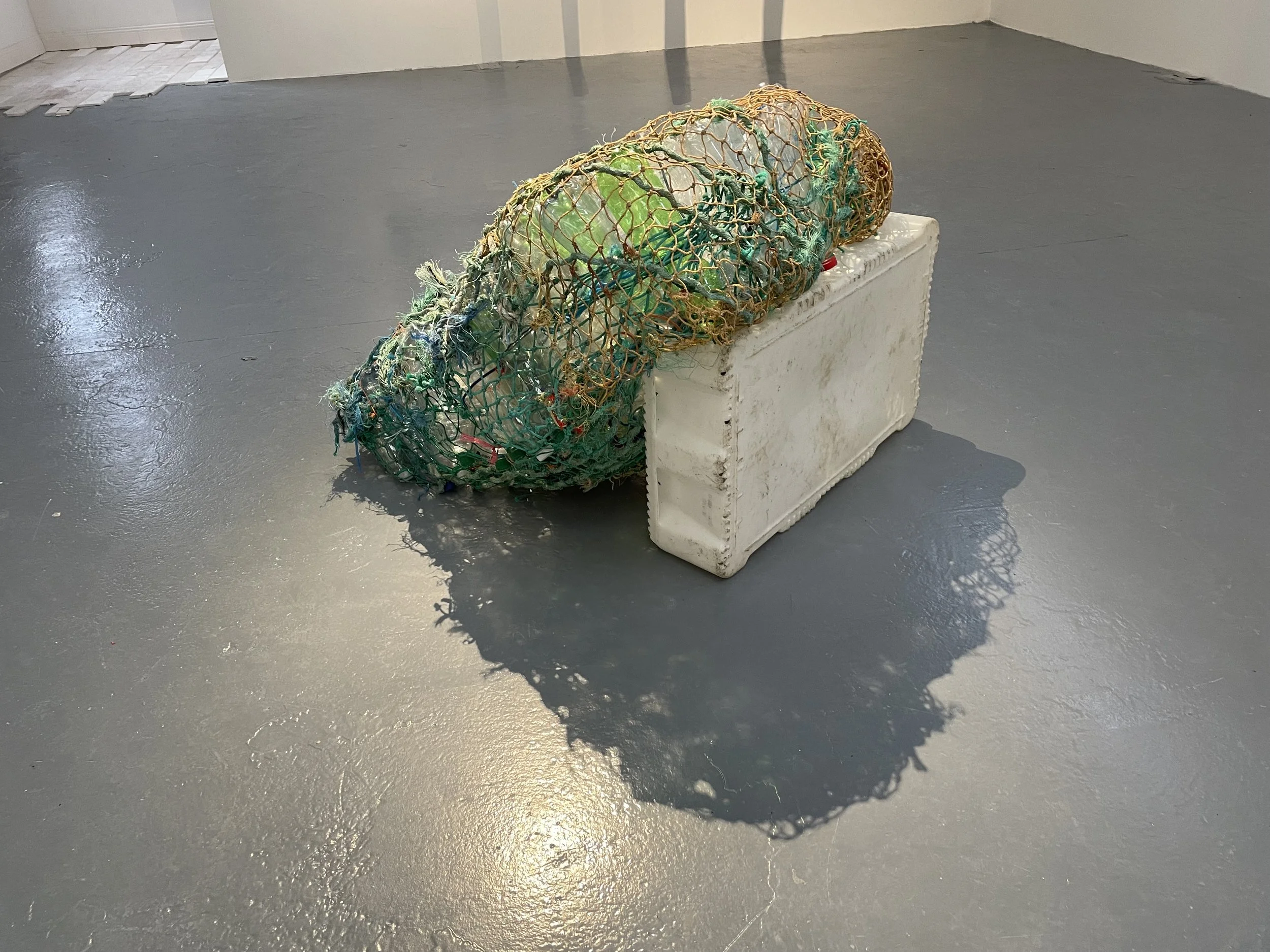 Raft 1, 2021.
Founds sea rope, commercial fishing net, citrus netting, and bottles collected from the  BCA community
