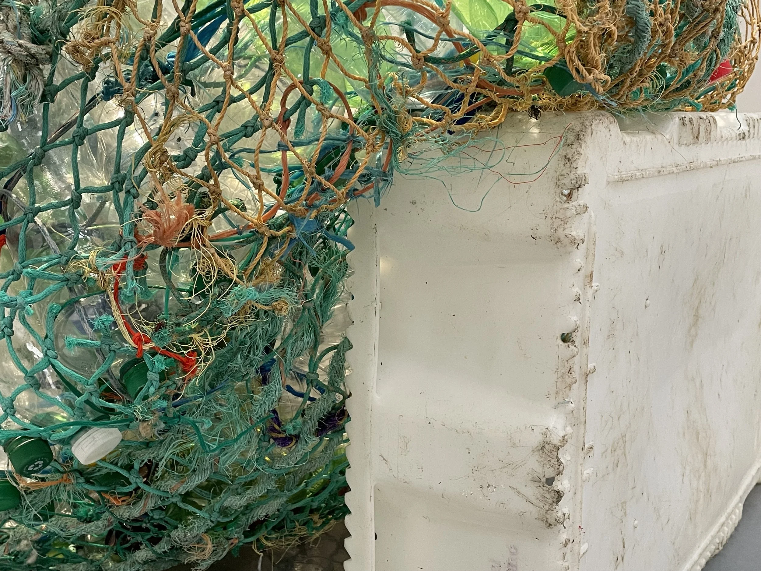 Raft 1, 2021.
Founds sea rope, commercial fishing net, citrus netting, and bottles collected from the  BCA community
