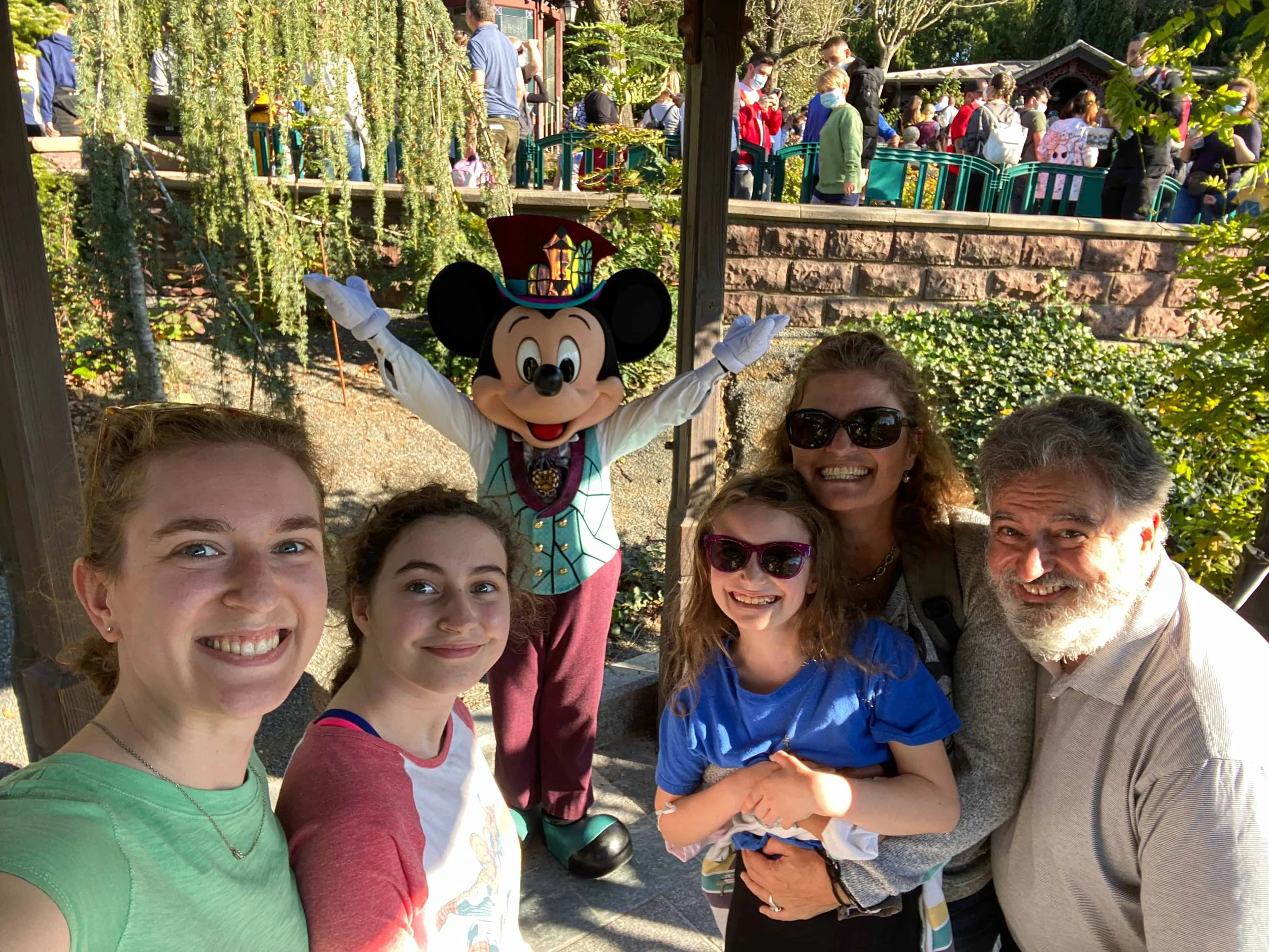 Family selfie with Mickey Mouse in his Victorian-style 2026 Halloween Festival costume at Disneyland Paris.